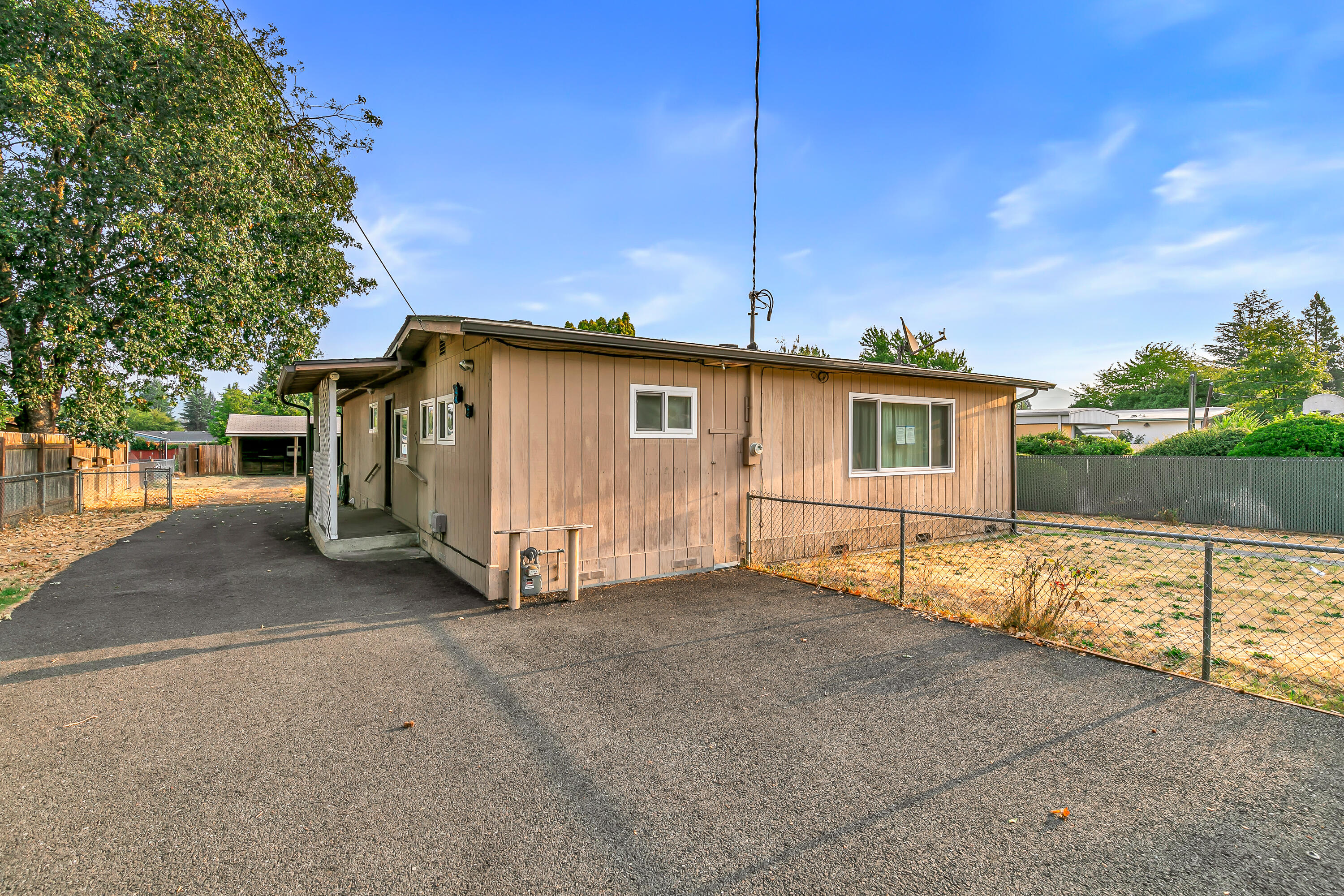 PRICE IMPROVEMENT of almost $30,000!!!  This charming 3 bedroom, 1 bath home sits on a big lot with tons of space for parking, growing, or expanding—lots of possibilities here! Whether you decide to keep the original character or update it, this home has room to make it your own.

As you walk in, you'll find a cozy dining area that leads right into the kitchen, which opens up to an enclosed porch. The living room is just off the kitchen, and the first bedroom is tucked nearby. On the other side of the house, there's a second bedroom with a bonus flex space—perfect for an office, extra closet, or whatever fits your needs!  The third bedroom would also make a great home office.

 Outside, you've got a big backyard, plus a detached carport with storage and workshop area .

At just $259,200, this one's a great find. Come check it out before it's gone!