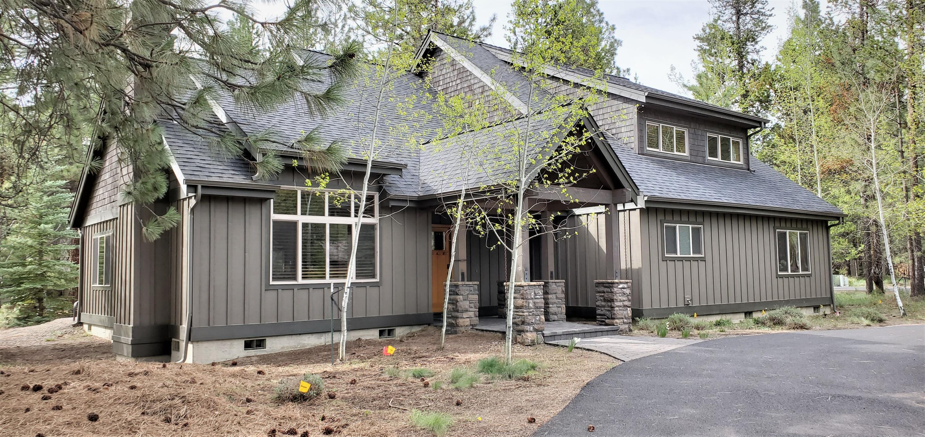 You may have just discovered your ideal Sunriver retreat, beautifully updated and offered turnkey. Looking for rental income as well as personal enjoyment? This 2,705sf 4 bedroom/ 4 Bathroom home with additional 612sf of garage delivers upscale Pacific Northwest living with room for up to 15 guests and a very strong rental history. Big Pines Lodge pairs warmth and luxury with vaulted ceilings, a cozy gas fireplace, an inviting great room, an updated kitchen, and a secondary lounge perfect for relaxed gatherings in a modern floorplan. Two primary suites including one on the main level add comfort and privacy. Step outside to an expansive patio with a covered hot tub, surrounded by the quiet of Sunriver's desired North end and very close to the SROA Member Pool and golf. Fully furnished, thoughtfully finished, and well positioned near bike paths, trails, and the Deschutes River, it offers an effortless four-season escape. Call today for a tour!