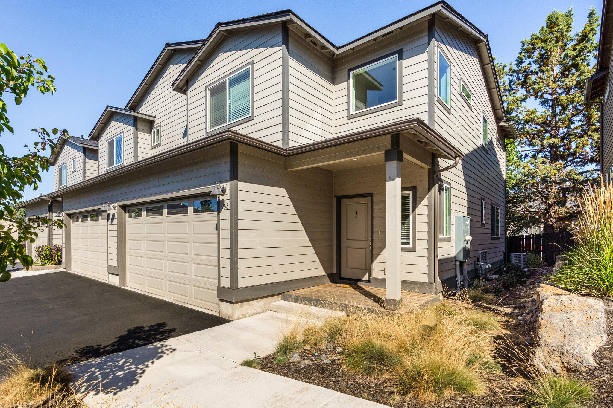 Nestled in a prime location near Pilot Butte trailhead and within an easy stroll to popular amenities such as Costco, Safeway, Lone Pine coffee, On Tap beer garden, less than 1 mile to StCharles Hospital and so much more! The interior is adorned with real wood knotty Alder cabinets, upgraded window coverings, LVP flooring, high ceilings, lots of natural light from the added end unit windows... The icing on the cake is the inclusion of air conditioning, quartz countertops and Whirlpool stainless steel appliances! Upstairs, you'll find all three generously sized bedrooms, a versatile loft area, and the laundry room, offering functionality and convenience. This home boasts an inviting and cheerful atmosphere throughout, a must see!