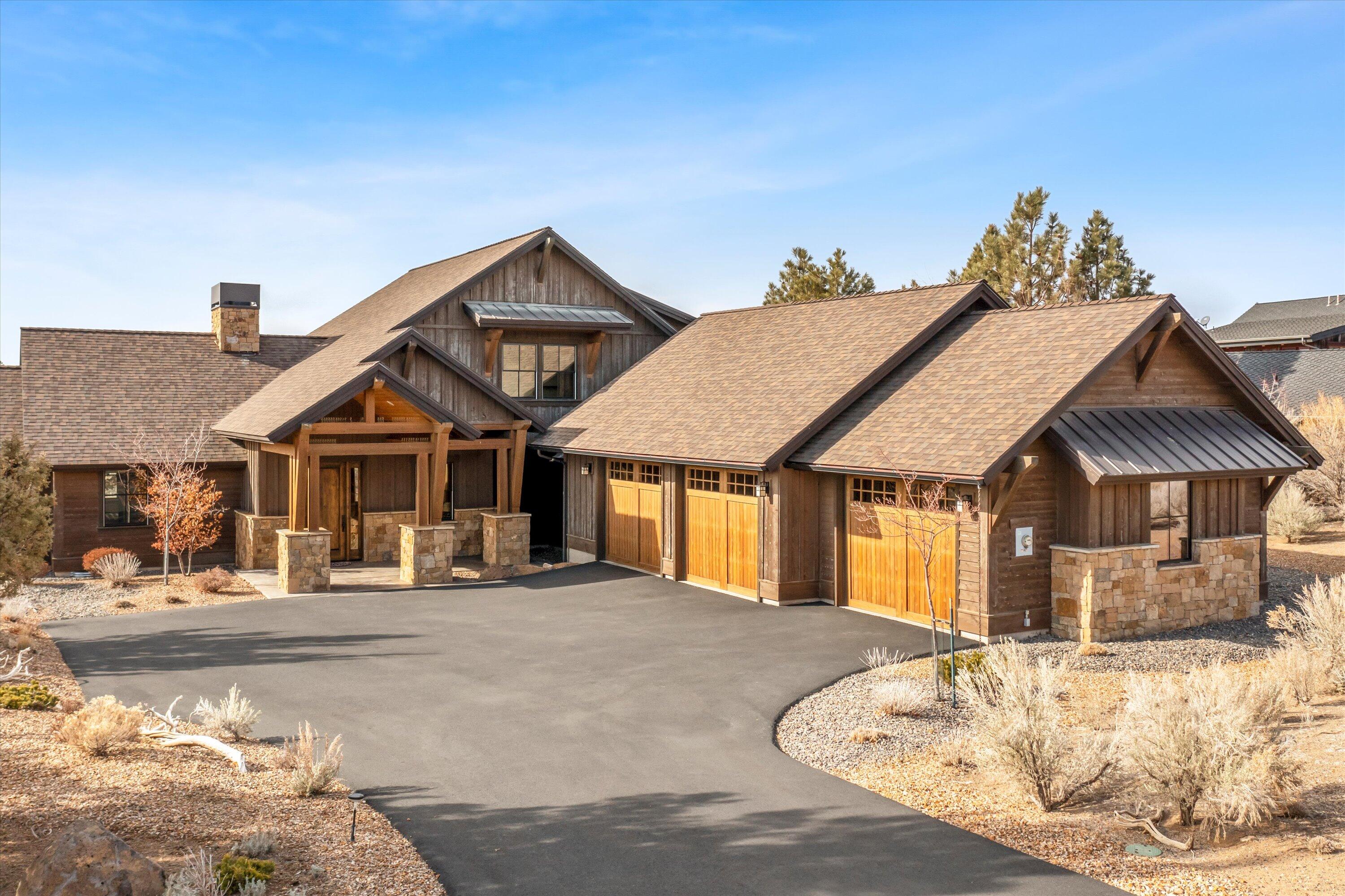 Northwest style home with panoramic views of the Cascade Mountain range and those priceless Brasada sunsets. Inside you will find a thoughtful open plan living space and a kitchen perfectly designed for entertaining and gathering around the expansive island.  The great room features a beautiful masonry fireplace flanked by custom built-ins, rising to meet the natural wood ceiling. Large sliding glass doors allow you to gaze outside to the stone fire pit and the picturesque Cascade Mountain backdrop. Rich and sturdy beams accentuate a spacious covered patio and lends itself to an uncompromised outdoor living experience here at Brasada Ranch. The primary bedroom is on the main floor with a spacious walk-in closet and master bathroom. On the second floor, there are two additional bedrooms each with ensuite bathrooms. An oversized three car garage offers plenty of storage possibilities and completes this ideal home.