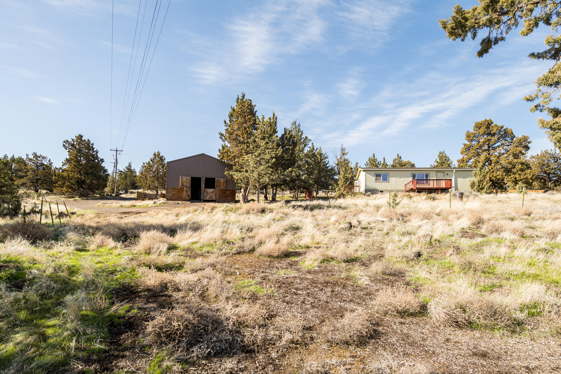 Private 2.5+ Acre Horse Property with Mountain Views
Located at the end of a quiet road, this 2.5+ acre property offers privacy, mountain views, and functionality. The 1,188 sqft home includes 3 bedrooms and 2 bathrooms, with a spacious primary suite that features a huge view, a soaking tub, and a walk in closet. Large windows provide plenty of natural light and views throughout the home.

The land is fully fenced, some cross fencing, and low maintenance. A 1,152 sqft shop/barn includes a converted area on the north side for horse stables. Enjoy open views stretching from Black Butte to Smith Rock. 

This property is ideal for anyone looking for space, privacy, and room for horses or toys. Lots of potential.
