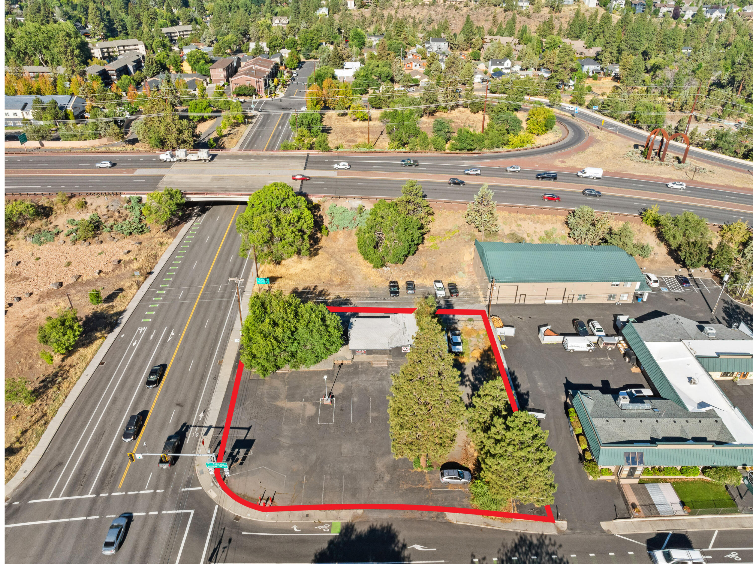 Situated on a highly visible corner lot at 1819 NE Division Street in Bend, this 0.44-acre property offers excellent exposure and immediate access to Highway 97. The 2,024 SF building is currently leased to Boneyard Pub, providing in-place income through July 2028 with a 6.04% cap rate. Zoned Limited Commercial (CL), the site allows for a variety of future uses including retail, office, or mixed-use residential development. Its strategic location at a signalized intersection, combined with strong area demographics, makes this an exceptional investment opportunity in one of Bend's busiest corridors. Do not disturb tenant.