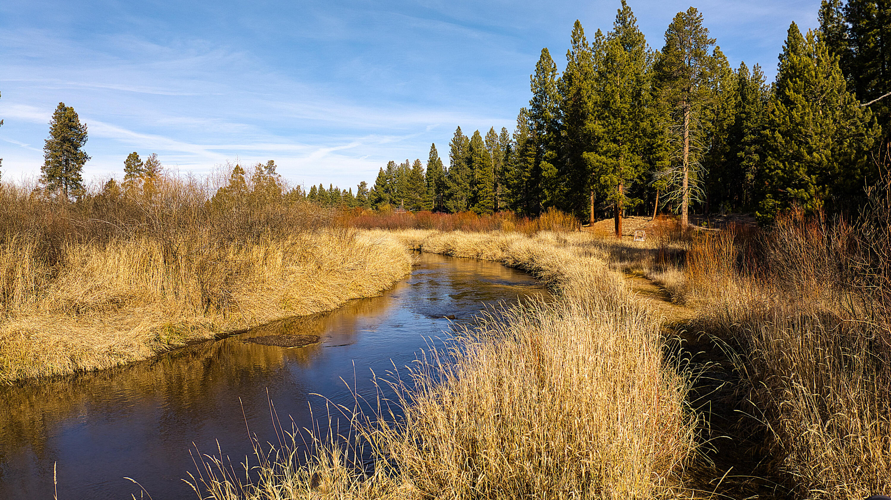 Once in a lifetime opportunity to own a riverfront paradise tucked away in a quiet corner of Central Oregon. This special parcel offers the ultimate in privacy, location, raw beauty, and views. Take your pick of elevated homesites balanced just above the riverbank with glistening views up and down river. Perhaps your perfect vantage point is against a backdrop of Mt. Bachelor or Masten Butte. The terrain is as diverse as it is beautiful; forested stands of timber, river inlets, & fertile bottomlands, all teeming with wildlife. Storage buildings, domestic well, a greenhouse, fenced garden, and well-kept grounds provide immediate enjoyment while leaving abundant opportunity for the new owner. Whether you're an angler, outdoor enthusiast, or looking to build your last home, this property checks every box.