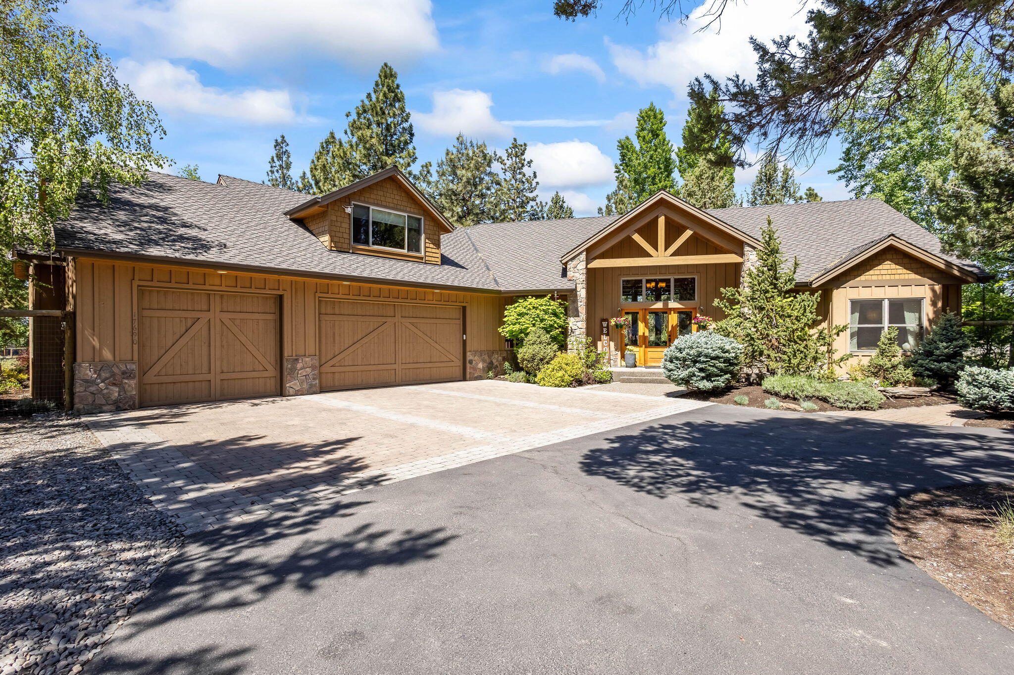 Meticulously maintained custom home with an open flowing floor plan, Cascade Mountain views and extensive landscaping. Interior features: Vaulted timber accented ceiling; hardwood flooring; floor to ceiling rock fireplace; Expansive windows with automatic shades; Stainless steel appliances, granite counters, and breakfast bar; Primary bedroom separated from other rooms with view of the Cascades, fireplace, large jetted tub, large walk-in shower and closet, double sinks, enclosed toilet, vaulted ceiling, deck/jacuzzi access; Huge bonus room. Exterior features: Expansive rear deck covering the entire width of the house with 3 access locations, gorgeous landscaping; Idyllic fire pit; Cascade Mountain and meadow views to the rear of the property. Large extended length 3 car, heated garage; Generous room for parking.