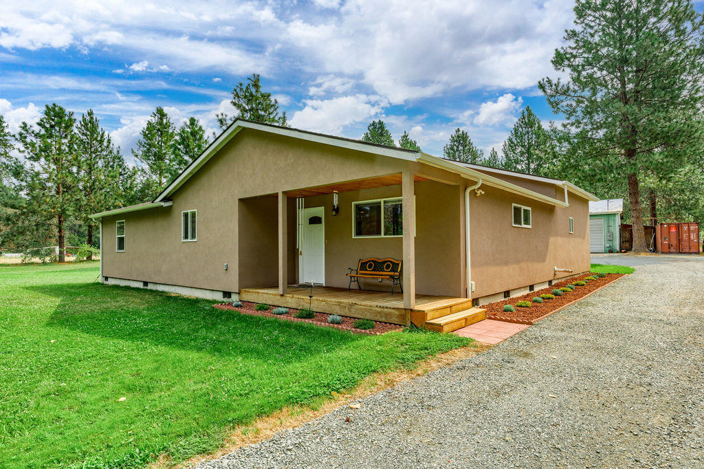 Just a few minutes outside the charming town of Rogue River sits this wonderful home on 1.56 acres of flat usable land. The original structure was completely remodeled and expanded in 2019 to create the gorgeous 1658ftÂ² home it is today. Featuring beautiful finishes, spacious rooms, high ceilings, stainless steel appliances, and a GIANT bathtub. The massive 30'x60' shop has four 11' tall doors, 220 power, heat, and more! There is plenty of room for the toys with covered boat parking, covered RV parking, and full hookups for two RVs. The fenced and gated yard includes a lovely garden space, irrigation, thornless blackberries, fruit trees, and so much more. Come see it for yourself! NOTE: square footage figure is per recent appraisal.
