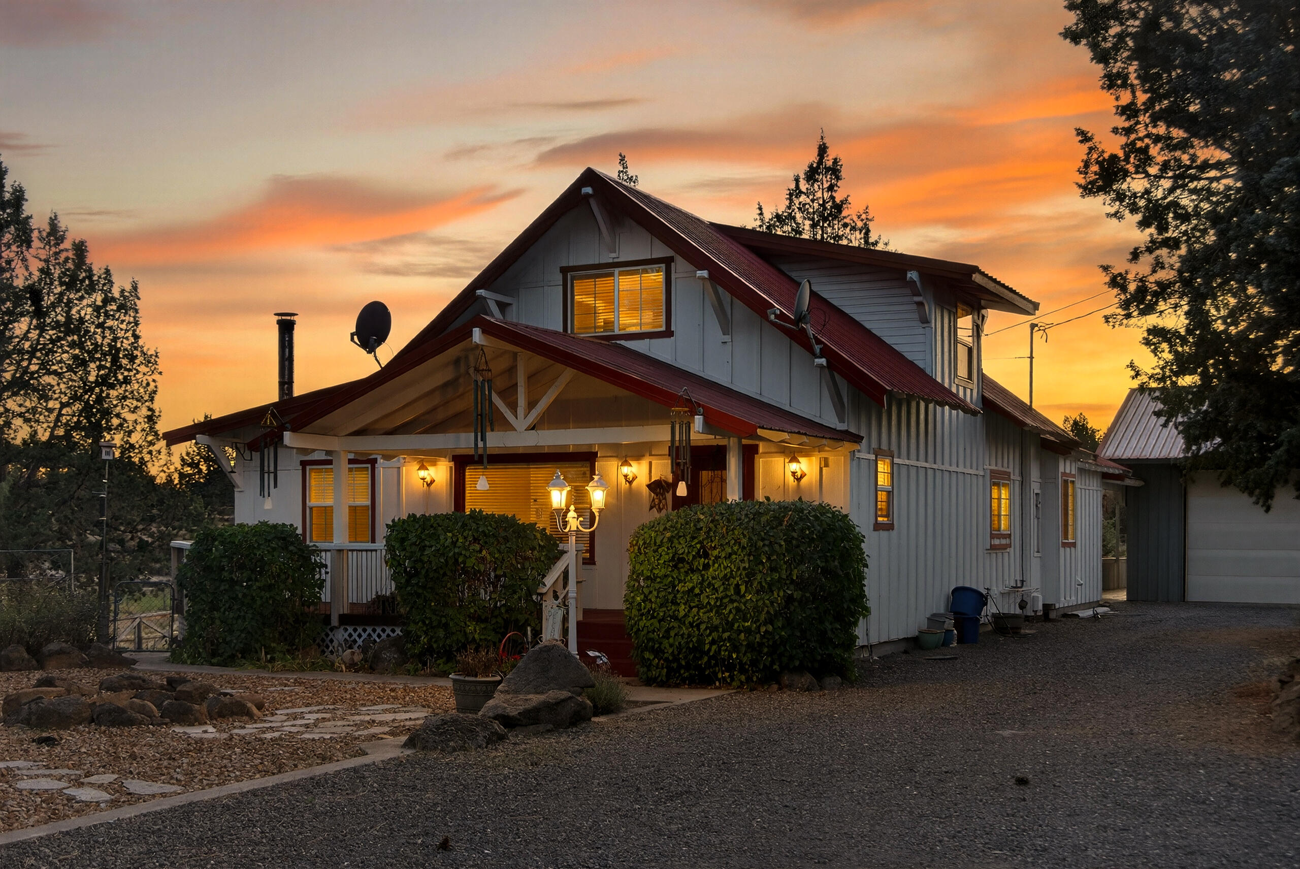 Discover your equestrian dream in the heart of Tumalo, Oregon! This farm-style home sits on a total combined lot size of 4.86 acres across two tax lots, with 2 acres of water rights on the main home lot. Perfect for horse enthusiast, a 3-stall barn w/ paddock, hay storage. Fully fenced w/ gated entry, offering peace of mind and seclusion with a water feature that welcomes you home. Large RV barn equipped with 20,30 and 50-amp hookups, perfect for adventurers or guests. 3 car garage ample space for horses, recreation and more.