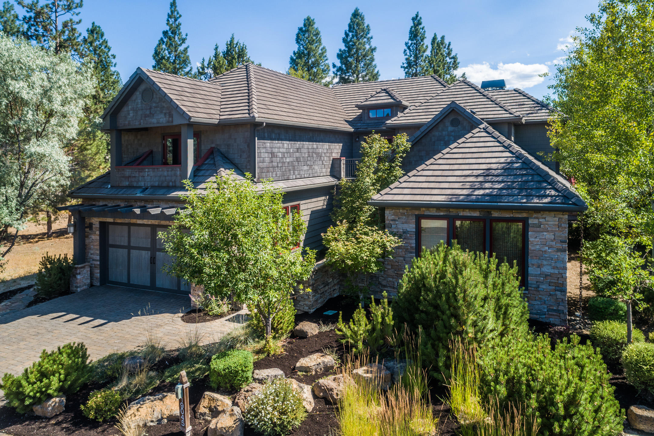 Come see this 2006 Tour of Homes winner! Custom built as the builders own home and showpiece for his business. This gorgeous home features rustic fir floors, distressed custom alder cabinets, hand troweled plaster walls and top of the line appliances, fixtures and lighting throughout. Combining stately
spaciousness with cozy elegance, this spectacular home offers 4 master suite bedrooms, 4.5 baths, and 2 fireplaces. With high ceilings and beautiful woodwork, this spectacular residence is offered turnkey including furnishings and art - right down to the silver ware. The tranquil back patio with built in BBQ and fireplace which abut common space, offer a great space to entertain, and make this home a must see!