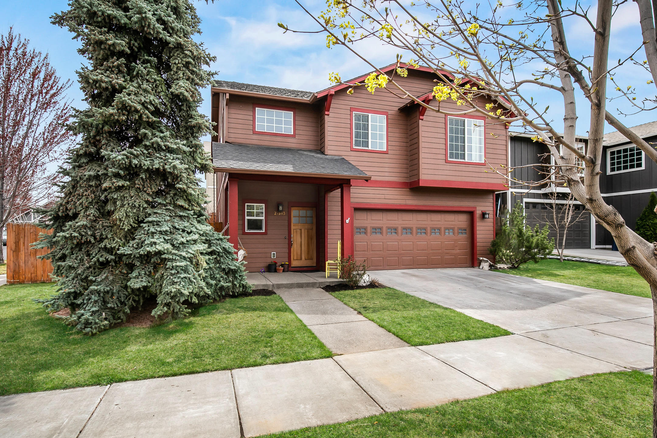 This lovely home situated on a private corner lot boasts an excellent NE location close to schools, shopping, restaurants, and Pine Nursery Park! Step in the front door to a spacious entryway with soaring vaulted ceilings and beautiful wood floors that run throughout the first floor. Enjoy an open greatroom floorplan full of natural light, with upgraded kitchen that offers solid surface countertops, butcher block island, full tile backsplash, gas range and pantry. Upstairs you will find nicely appointed bedrooms as well as a large bonus loft that is perfect for a play room or office space. The fully fenced backyard has terraced gardens and two new raised beds for growing veggies. Come see this house today- it won't last long!