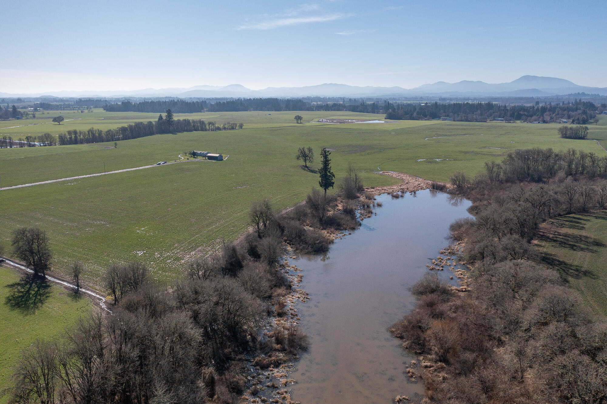 Spectacular 80-acre estate just minutes from OSU and Corvallis. At the end of a private half-mile drive, a well-maintained 2093 sqft manufactured home offers stunning views of the Coast Range and Cascades. Predominantly Class I and II soils with 6 acres of water rights provide excellent agricultural potential. A rare ancient lake on the property holds evidence of early human activity in North America. A unique blend of history, productivity, and breathtaking scenery—an opportunity not to be missed!
