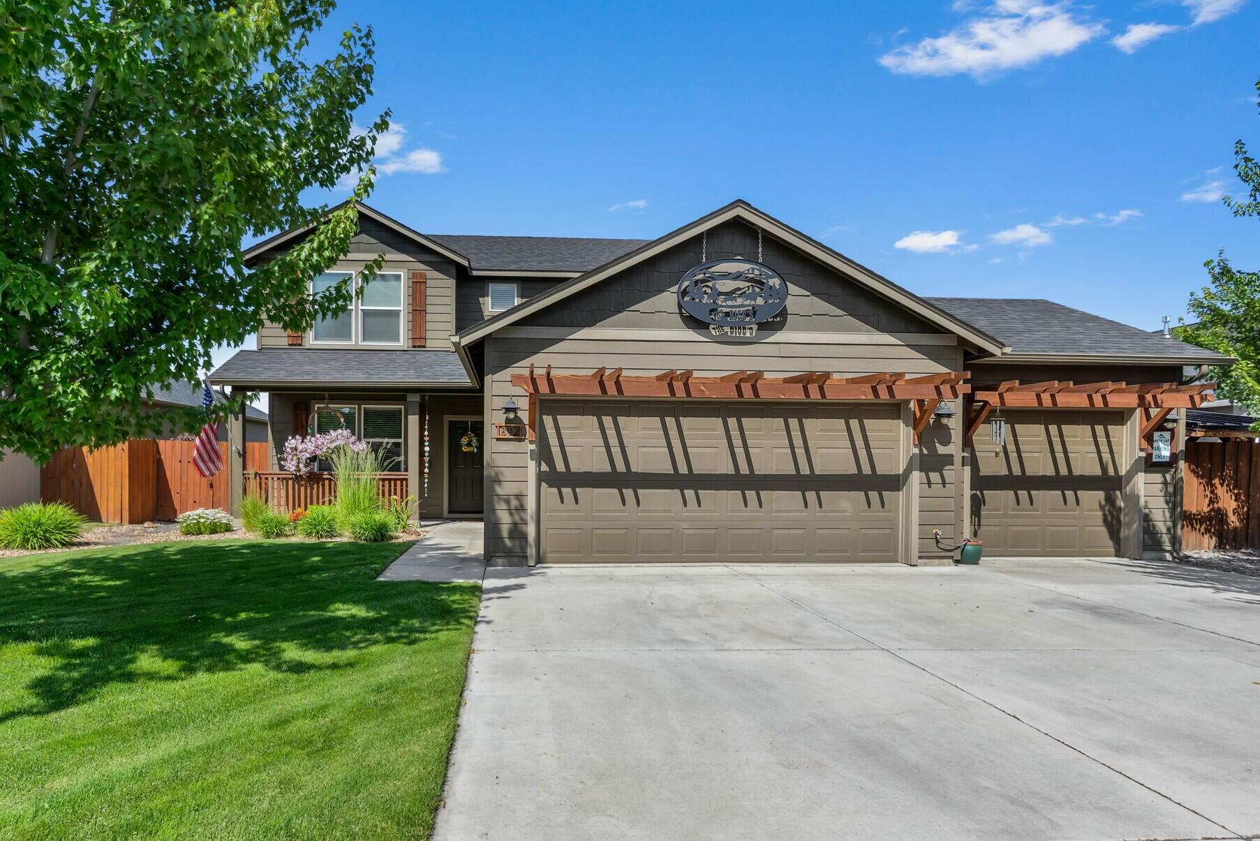 Don't miss this impeccably maintained home in NW Redmond ½ mile from West Canyon Rim Park. This home has it all; curb appeal, well thought out spaces, craftsmanship & thoughtful design throughout. Great room plan w/an abundance of natural light, hardwood floors, & cozy stone surround gas fp w/mantle. Open kitchen ftrs island w/brkfst bar seating, spacious dining area w/sliding doors to patio, an abundance of cabinetry & counter space! Primary suite ftrs striking accent wall, massive walk-in closet, dual sinks in bath, soaking tub, & step-in shower. 2 addtnl bedrooms share a full bath + laundry room w/built-in shelving. 4th bedroom or office space downstairs has access to a full bath on the main. Your fully fenced backyard oasis ftrs a covered patio w/pergola & entertainment space. Gorgeous landscaping ftrs sprinklers in front/rear plus a thoughtfully designed garden area that offers space for flowers, herbs, or veggies. Storage shed w/paver patio surround, triple car garage + more!