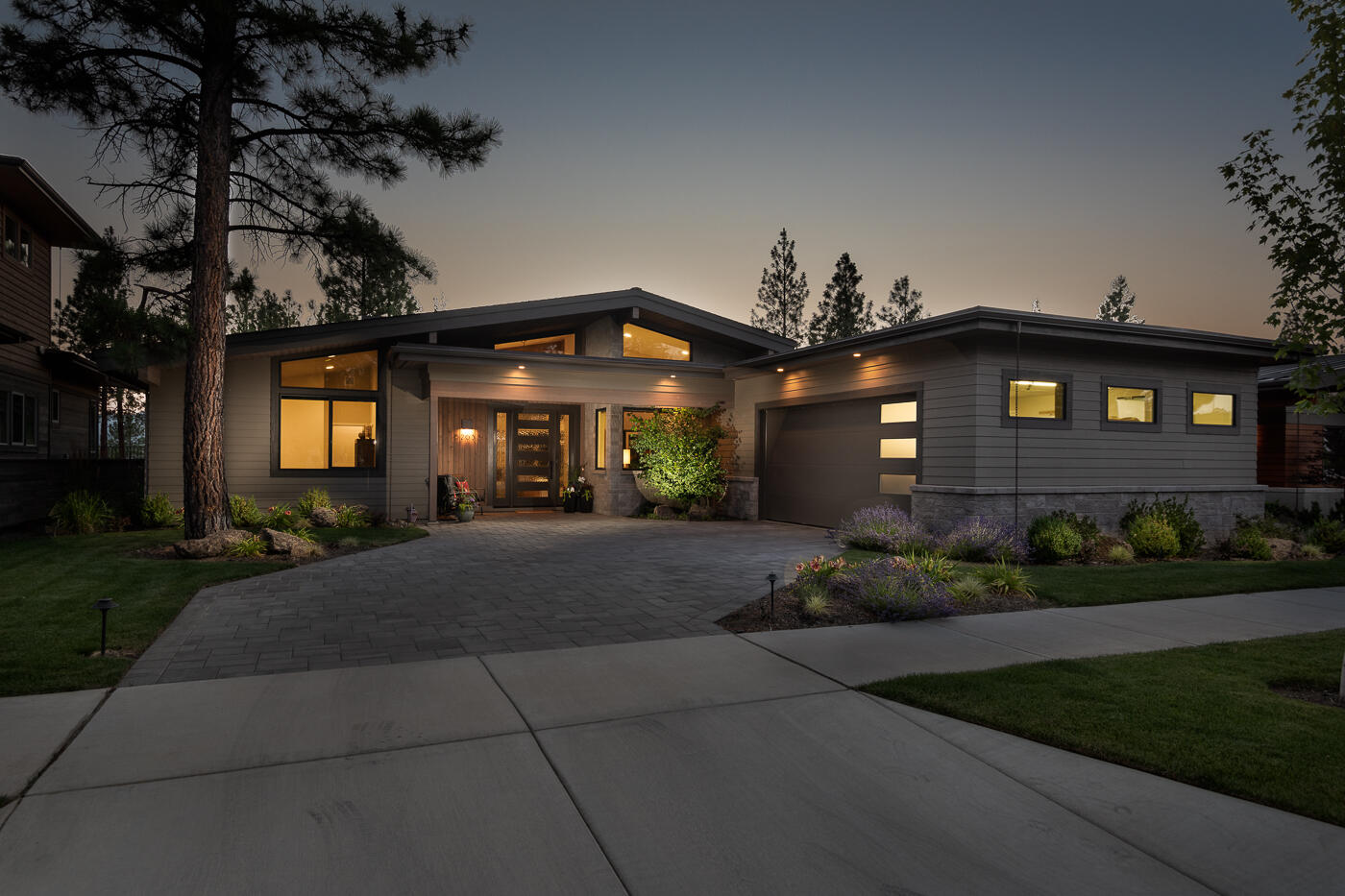 Amazing single level custom home built by Rundle Construction located in NW Bend! Spacious modern layout with beamed vaulted ceiling plus wall of windows leading out to paver patio with gas fireplace and TV. Kitchen is fully equipped with Thermador appliances, custom cabinets, built-in refrigerator and wine cooler, large island with quartz countertops. Butler pantry with dishwasher, refrigerator and prep space for entertaining. Primary suite has beamed vaulted ceiling, fireplace and separation for privacy. Primary bath with a soaking tub, curbless walk-in shower, skylights and large walk-in closet with built-ins. Guest suite features full bath, tile shower, walk-in closet and built-ins. Third bedroom has vaulted ceiling with access to full bath with tub/shower combo. Large office with vaulted ceiling, spacious mudroom and dedicated laundry room. Well appointed home with many upgraded features. Conveniently located near Shevlin Park, trails, restaurants, shopping and downtown.