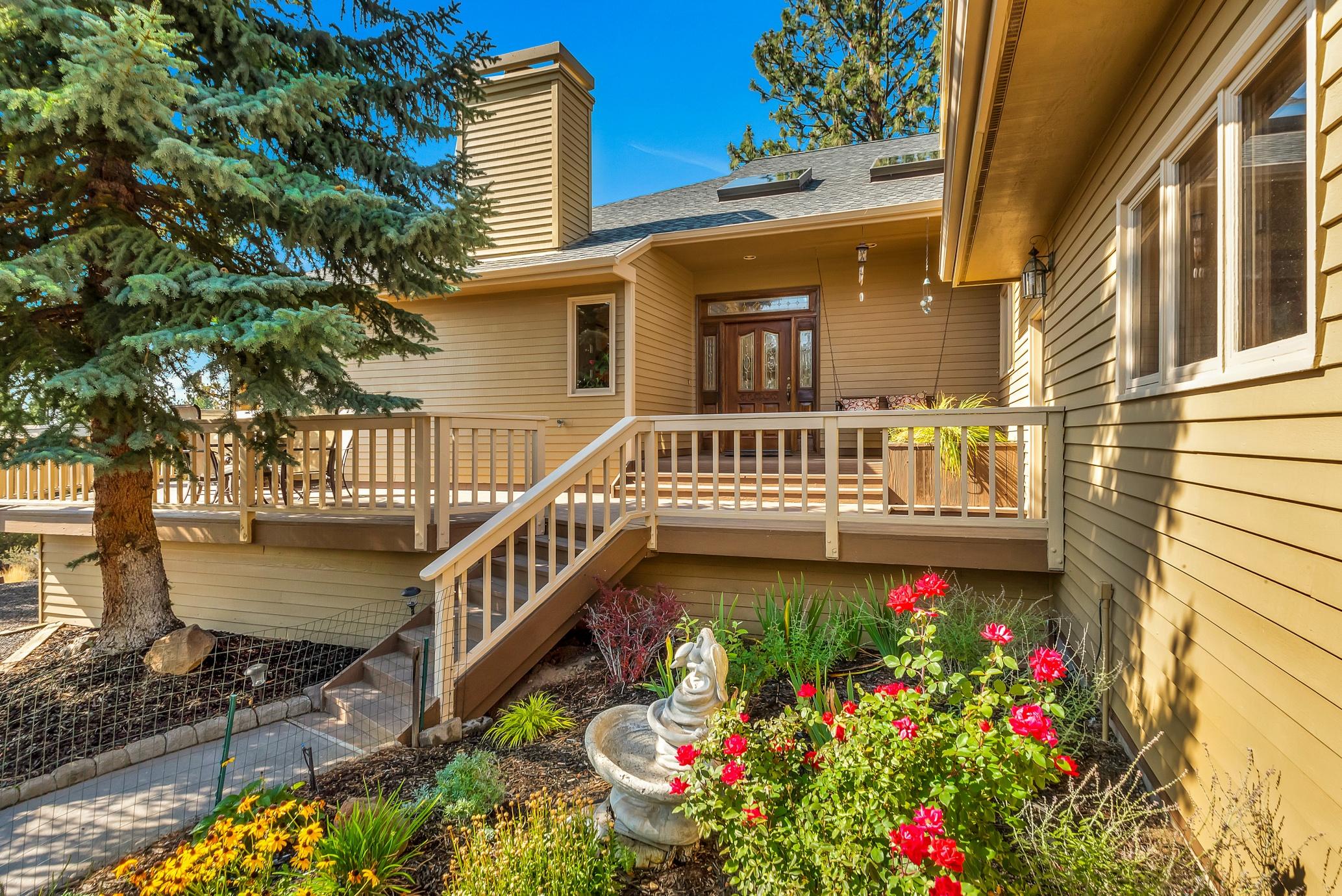 Central Oregon at its best. East Mountain & city views from 1.95 acres of privacy on Awbrey Butte, in the heart of Bend's Westside. Close to schools & shopping. 3589 SF of warm, rustic charm grace this 5 BD/3.5 BA home. Ideal for entertaining, this home features huge vaulted ceilings & open floor plan w/warm wood accents throughout. Kitchen boasts a beautiful curved granite island, mega storage, & stainless double ovens & refrigerator. Natural light radiates throughout from large skylights & picture windows. Cozy up w/2 indoor gas fireplaces, wake up to warm radiant floor heating in kitchen & master bath From the main floor master, step out to over 1500SF of wraparound deck for outdoor living at its finest w/a 3rd gas fireplace, hot tub, water feature. wildlife, & elegant landscaping. Abundant storage w/a heated over􀋐sized 3--car garage & 760SF basement. Serenity, views, & nature all in the heart of Bend.