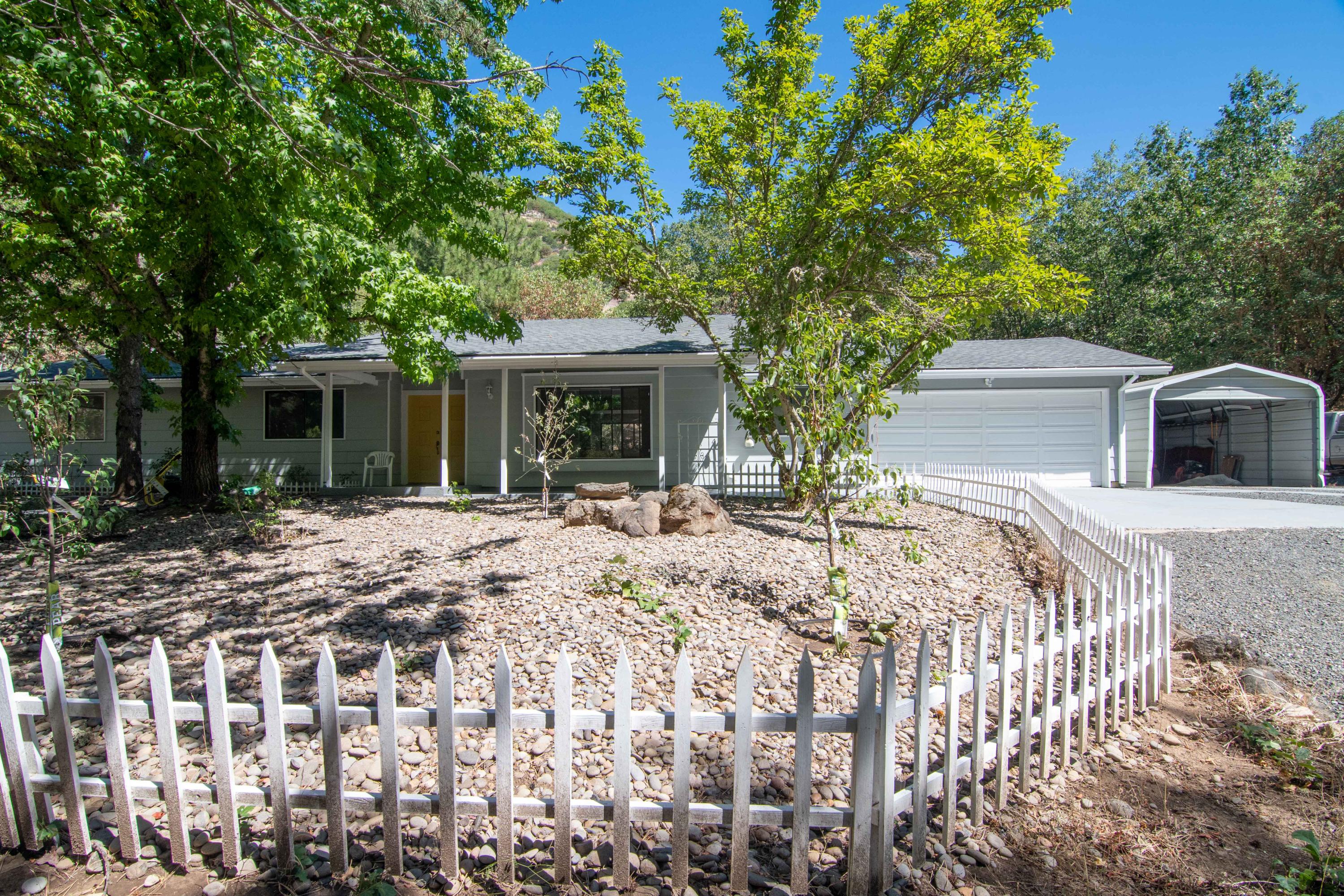 This home has been updated and is ready for you to move in! This one bay shop has a 2/1 apartment attached to it and could be a great granny flat or income potential! Located between grants Pass and Medford and close to many of the might Rogue River boat ramps, this property has it all including hiking trails, biking trails and even ATV trails. The front yard boasts a plethora of fruit trees, and trees just beyond provide the perfect amount of afternoon shade! There is something for everyone on this beautiful piece of property. Make your easy to show appointment today and discover for yourself what or can't live without!