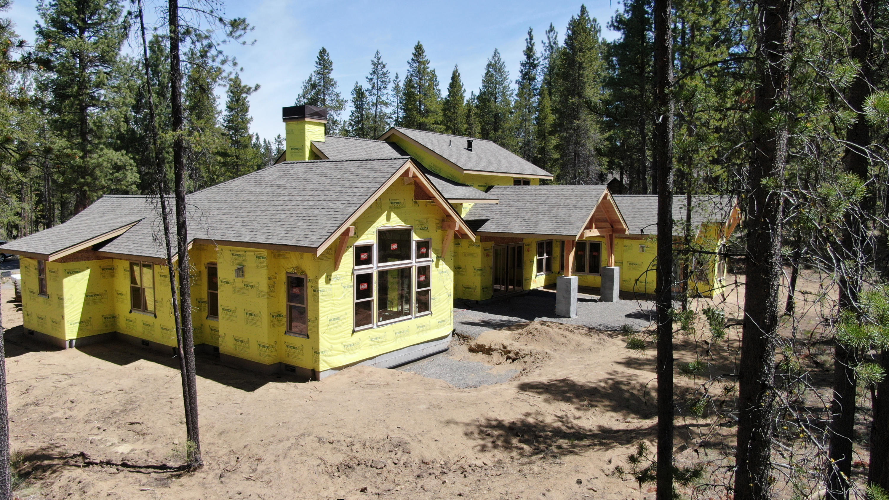Slated to be completed in Fall 2020, this custom NW style home offers ample gathering spaces perfect for large families, reunions, retreats, and special get-a-ways. There are three master suites on the main level along with great room, gourmet kitchen, dining room, office, bunk/media/recreation room, laundry/mudroom, and an expansive covered paver patio with hot tub for relaxing or entertaining with views towards the forest. Upstairs find three more suites. Features include distress wood beams, custom cabinetry, rich woods, solid surfaces, designer tile, high-end appliances, built-in fridge, and wi-fi enabled two zoned Central A/C. Contact your agent to preview today.
