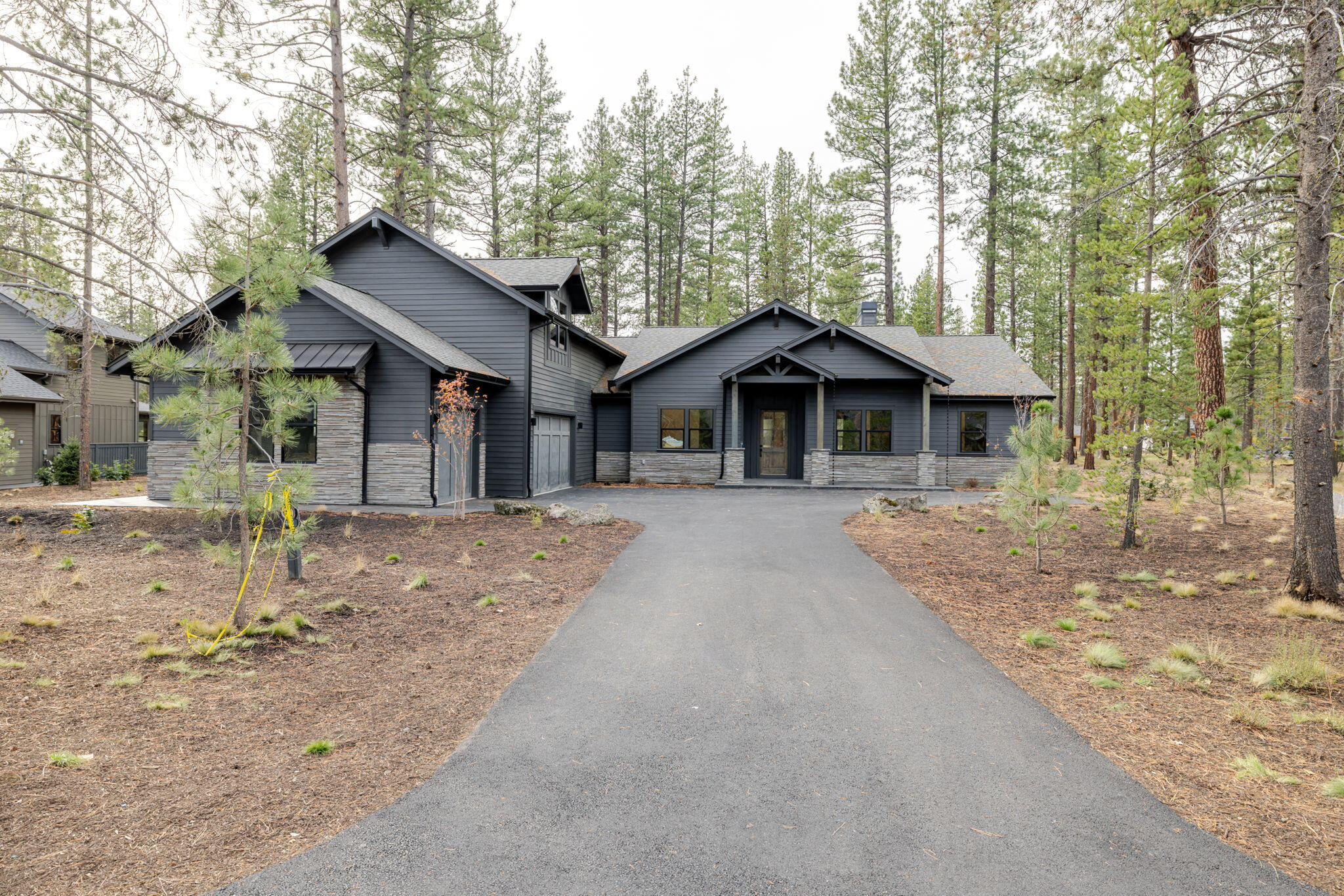 Overlooking the tranquil setting of Preservation Park, this 5-bedroom new construction home is thoughtfully positioned and appointed.  The main level features an open great room leading to the kitchen, appointed with a quartz counters, Thermador appliance package, custom alder cabinetry, spacious walk-in pantry and a dedicated dining area. Ideal for everyday or vacation living, the main level offers 4 en-suite bedrooms plus an additional bedroom or flex room. Upstairs enjoy a spacious bonus room and large storage areas. Situated on a spacious 0.40-acre lot, the home is positioned to capture park and water feature views from the west-facing back patio-a peaceful setting for quite mornings or evening sunsets. 3-car garage and dedicated laundry room with a tile dog wash. Owners benefits include exclusive access to Caldera Springs amenities including Caldera Links 9-hole golf, Forest House, Lake House dining, Quarry pool & fitness, pickleball, tennis and more.