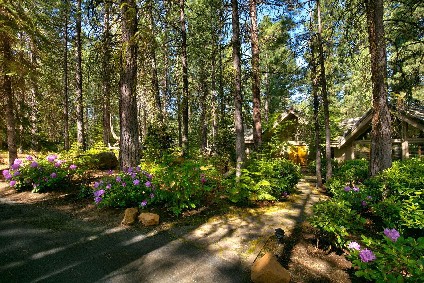 This single level custom home is situated on the Glaze Meadow Golf Course with four spacious bedrooms, including two master suites. With a generous 3,152 sq. ft. of living space and a sprawling 1.14-acre lot with lush gardens and a sweeping lawn, this home offers plenty of room for you and your loved ones to spread out and enjoy. You'll love the wooden plank vaulted ceilings throughout, numerous skylights and three wood burning fireplaces, which create a cozy and inviting atmosphere no matter the season. The chef's kitchen is a true highlight, with ample counter space and top-of-the-line appliances. Step outside onto the large deck and take in the breathtaking views. Nestled on a private cul-de-sac, the home is a stone's throw from the Upper Glaze Meadow Pool/Tennis Complex. This setting is perfect for entertaining guests or simply relaxing with a cup of coffee. You have your choice of watching golf, or enjoying looking out on the peaceful, undisturbed wooded grounds.
