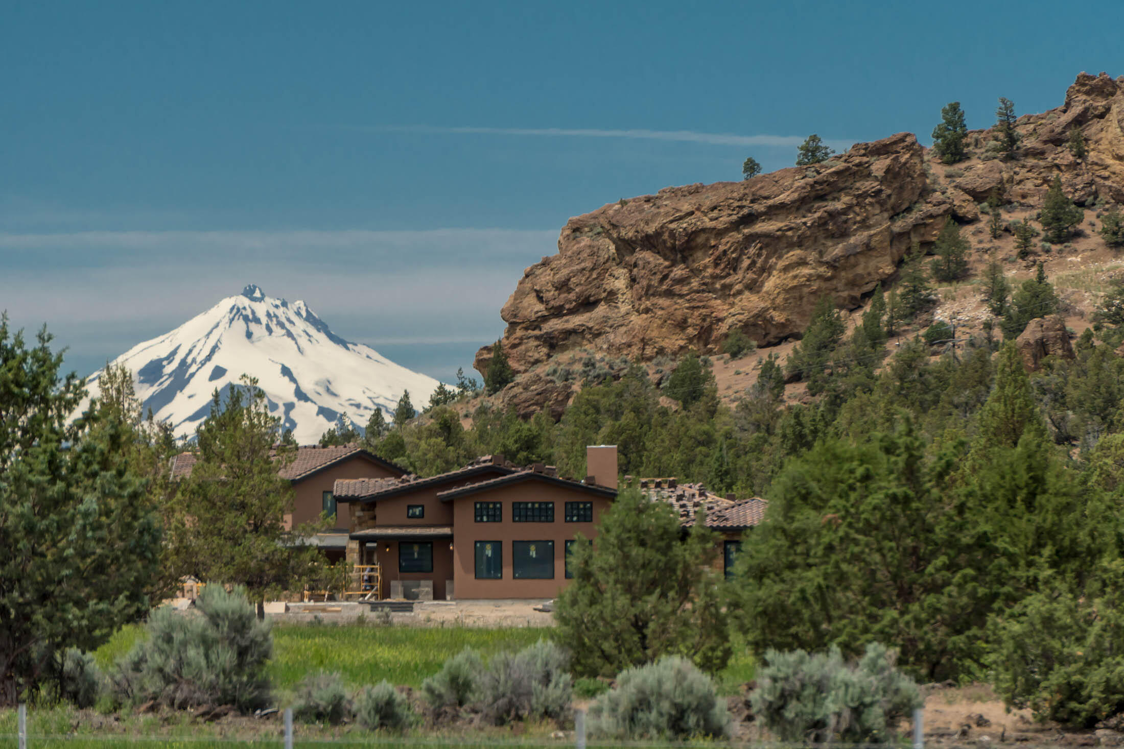 Welcome to Lone Pointe. Unrivaled in its beauty and tranquility located at the base of coyote Butte behind the gates of the pristine Ranch at the Canyons. Surround
yourself with the towering walls of Smith Rock the winding Crooked River and the vast fields and Vineyard. 3140 Single story home with additional 1,132 sqft guest suite
and bonus area above the large 3 car garage. The main bedroom and bathroom feature heated floors, walk in shower and stunning barn wood tongue and groove ceiling.
Home also features 2 additional en-suites, wet bar, slab granite counter tops. Additional distinctive attributes of the 11.28 acre landholding include an open breezeway
overlooking one of the infamous ponds at the Ranch and incredible outdoor living with propane firepit, hot tub and built in BBQ all looking toward Monkey Face.