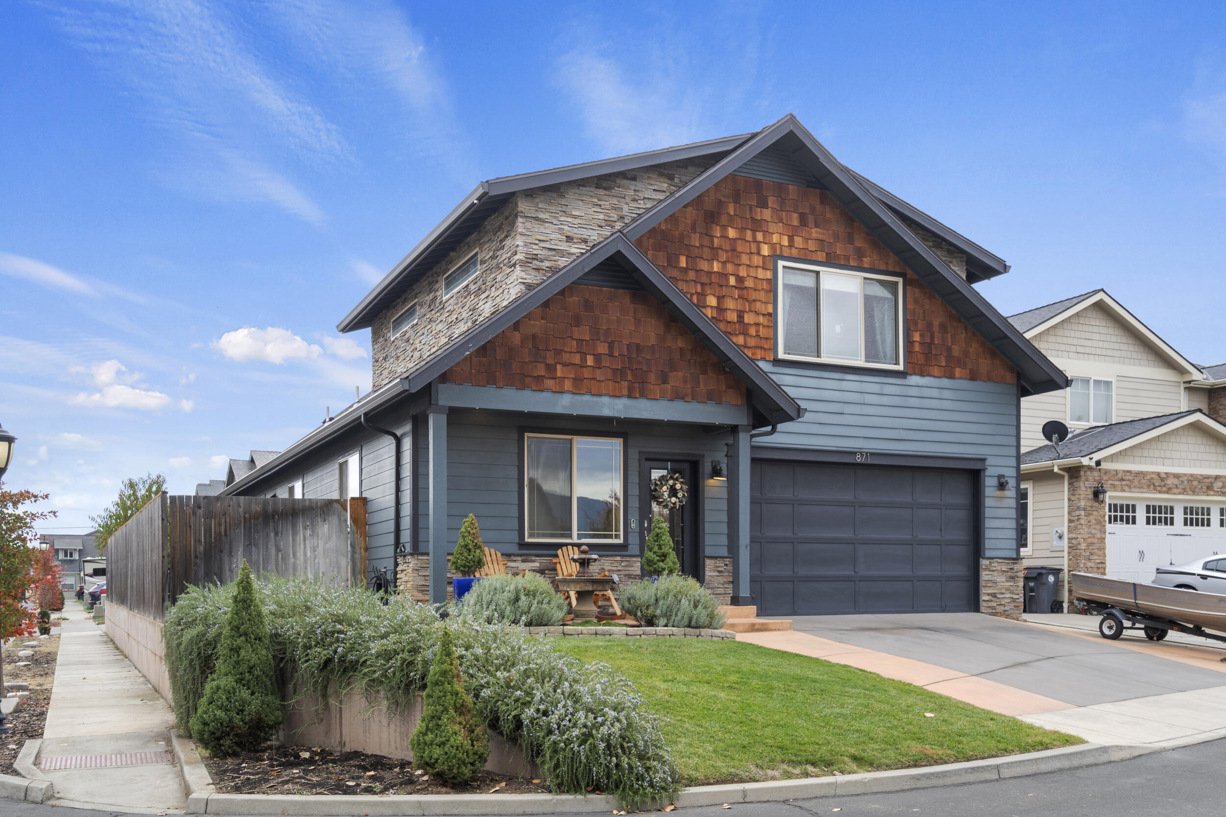 Warmth and charm abound in this turn-key Central Point gem with 3 bedrooms, 2.5 bathrooms, and unique finishes! This home is oversized but cozy, with a large kitchen island, granite counters, jack-and-jill bathroom between the guest bedrooms, warm wood flooring, and soaring ceilings that lead to an extra hangout area outside of the large primary ensuite- which includes a show-stopper bathroom. You will love the tidy and private backyard, corner lot, and low traffic street with creek frontage. Make your appointment today!