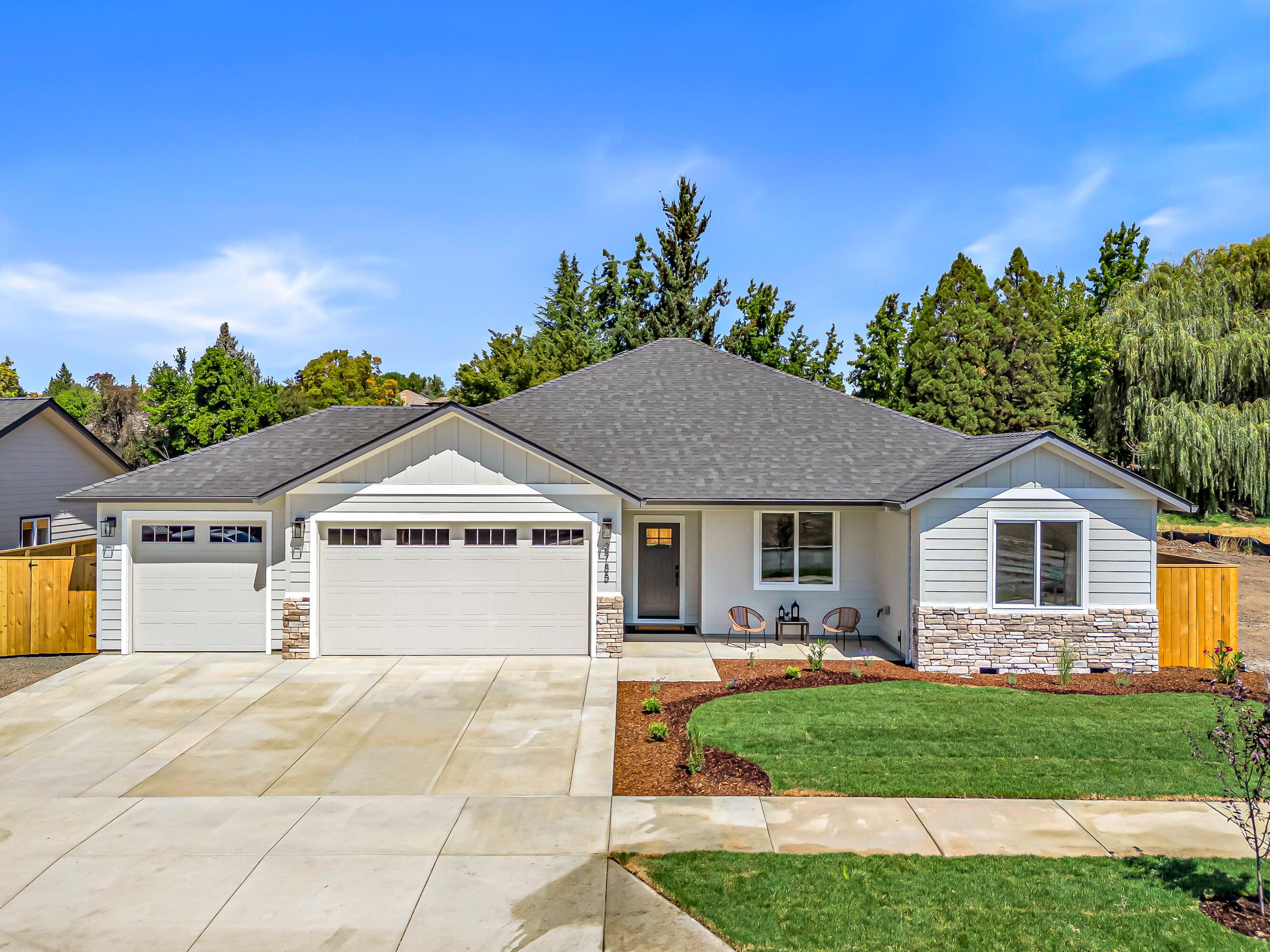 There's nothing like the comfort and quality of a new home. Especially one in East Medford's newest neighborhood, built by highly regarded Brian Magel. This custom, one-level home sets on a large, private fully fenced and landscaped, pool-sized lot, perfect for your lifestyle. Inside is an open layout offering soaring vaulted and 9' ceilings and fine details such as fully-trimmed windows, one-panel shaker doors and ceiling fans. The spacious plan is further enhanced by contemporary light fixtures, water-resistant vinyl flooring & designer paint. The chef's island kitchen will delight any cook with generous wood cabinets, quartz countertops & luxurious Whirlpool stainless appliances. Retreat to the primary suite with dual vanities, a walk-in closet & full shower. Join the ranks of clean, efficient, all-electric living with a heat pump HWH and an individual room-controlled, multi-zone, ductless mini split HVAC. 3-car garage plus behind-the-gate storage for a trailer, boat or small RV.