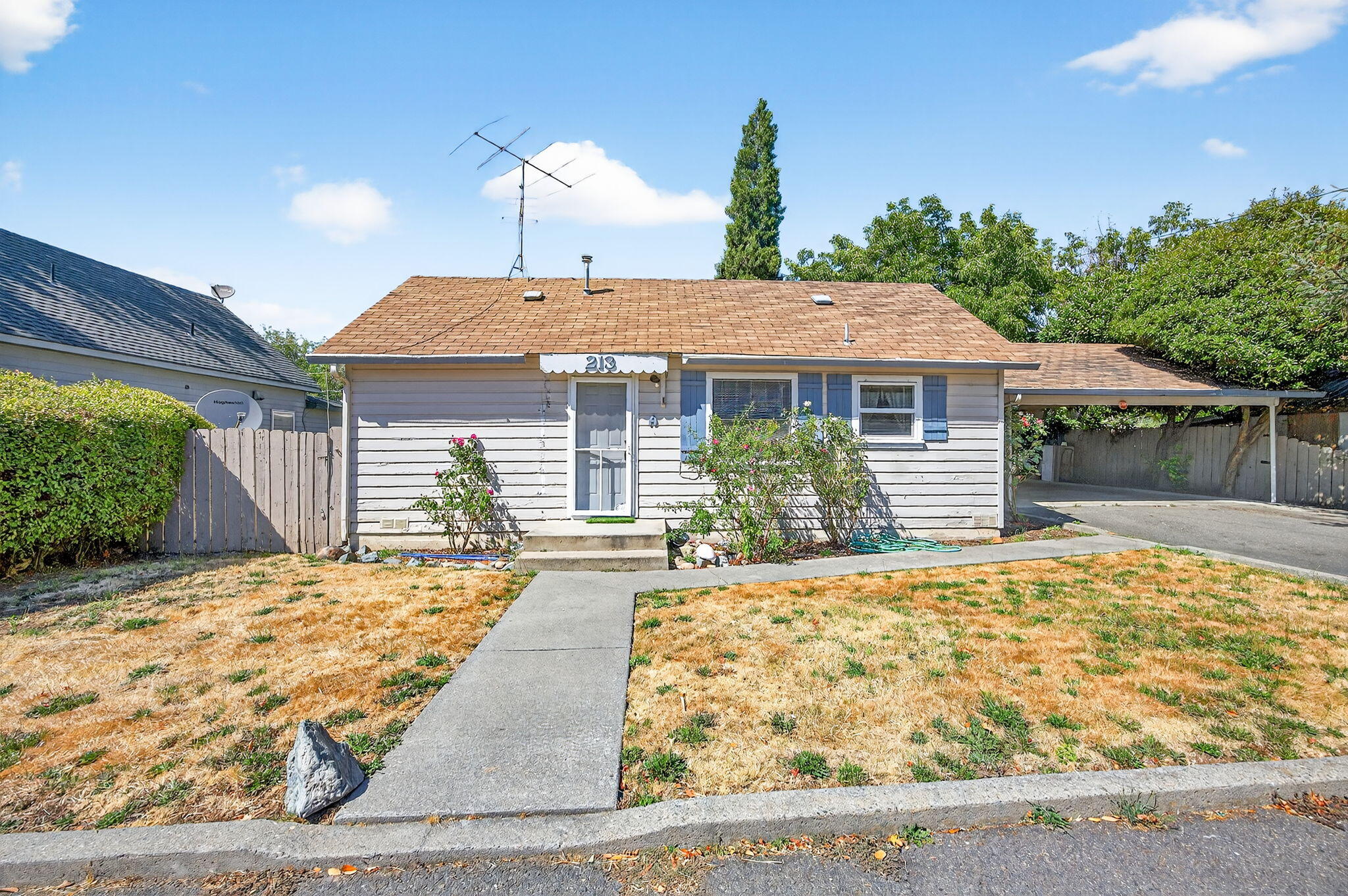 Investment Opportunity.  Two separate homes;  live in one and rent out the other one.  A 2 bedroom 1 bath and 1 bedroom, 1 bath home.  Built in 1960; back home is 1,000 sf and front cottage is 396 sf.  An attached over-sized 2 car covered carport.  Back storage building.   Lot is .19 of an acre; with rear fencing. Homes need updating to make them your own.  
Convenient Rogue River location.
Take a look.