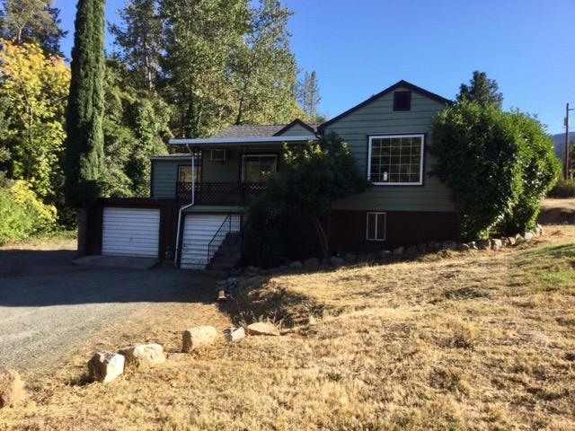 This 1420 sf 3 bd. 1 bath home with lovely views is on .79 acres. Needs TLC. Cash sale. Partially finished basement with 2 car garage plus shop area. New gas furnace in livingroom. New septic in 2002. New well pump in 2005. Rental or starter home on very nice property with irrigation from GPID. The closets have been removed from the bedrooms. AS-IS