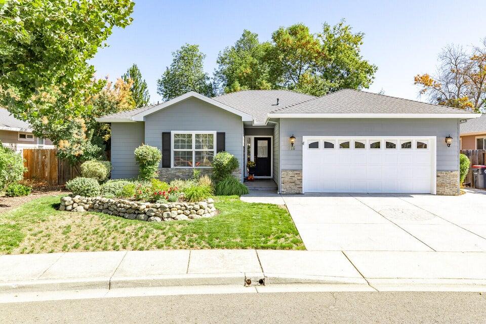 Enjoy the quiet park-like setting of this single level home on a cul de sac, bordering Jackson Creek. Built by Mahar in 2003. 3 bedroom, 2 bath, 1,632 SF on .18 acres. The contemporary kitchen features granite counter tops, an island with breakfast bar, ample cabinetry and dining area. The living room features a gas fireplace and open space suitable for either formal dining, office area or bonus room. The master bedroom has a large walk-in closet, step-in shower, claw-foot soaking tub and French doors opening to the backyard. New interior paint, hardwood floors and carpet. The beautifully landscaped backyard with large stamped concrete patio and new wrought iron fencing, allows a view of the green belt along the creek. New slate steps down to the creek. Side yard dog run and garden shed. Walking distance to Twin Creeks Parks and shops, No HOA.