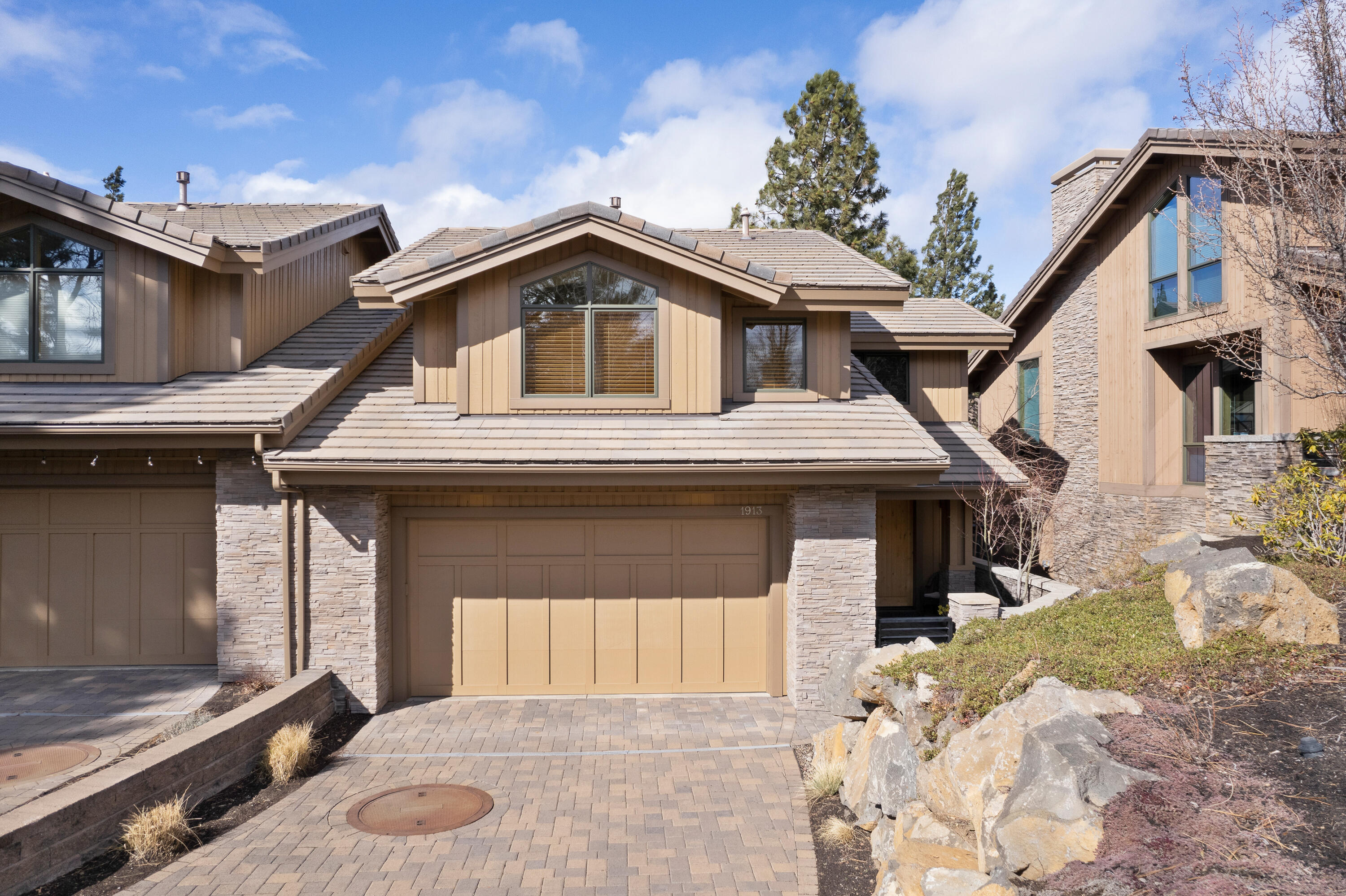 This flawlessly maintained and updated townhome is part of the riverfront Rocky Point community & is what living in Bend is all about. Walk or bike the river trail to downtown Bend for food or drinks, or sit on your patio & enjoy the beautiful Deschutes. This 3 bed, 2.5 bath, 2251 sq. ft. townhome is well appointed with SS appliances, slab granite kitchen counters & bar. New interior/exterior paint, New wood floors, stacked stone fireplace, & Riverview from the primary bedroom. Don't wait!