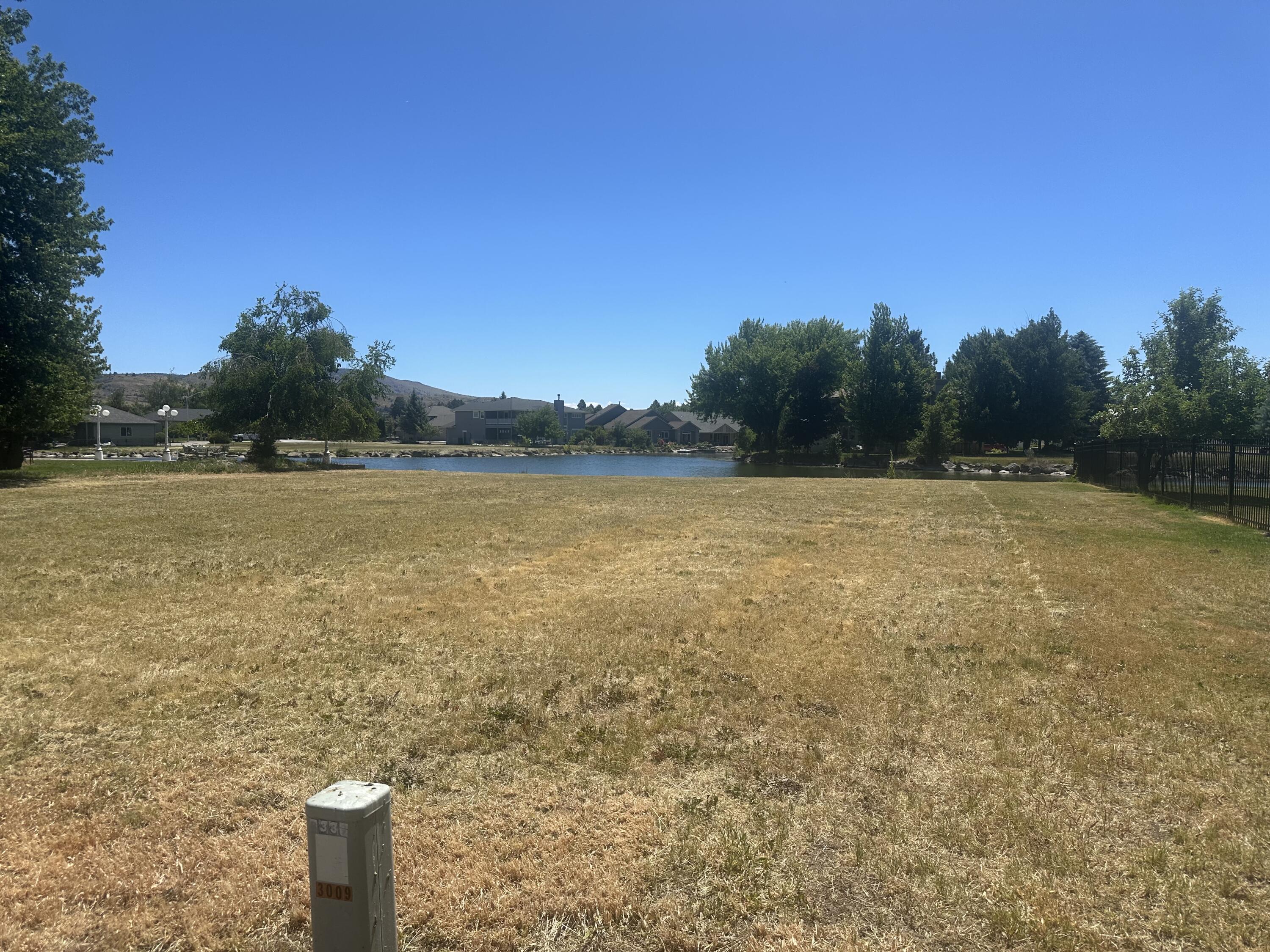 .28 acre waterfront lot with a beautiful view of the channel and Klamath lake directly across the street! This lot is a short distance from the Harbor Isles golf course, club house, Harbor tennis and fitness club, Pelican Marina and the Yacht club to name just a few. The HOA allows private docks and provides a boat lift to gain access from the channel into Klamath lake. Don't miss this opportunity to build your dream home on this premier lot!