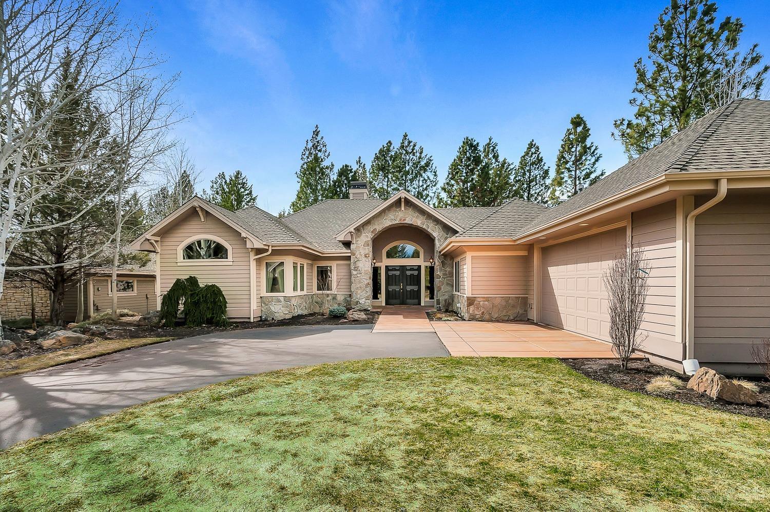 This single level Awbrey Glen gem is immaculate. Exquisitely upgraded throughout with new flooring, paint, slab surfaces and tile showers, it feels like a model home. The open floor plan flows perfectly! The generous living room opens to a chef's kitchen and dining room, all with vaulted ceilings and picture windows. Three beds, two baths and an oversized garage with flat driveway. Nestled at the end of a quiet cul-de-sac, looking over the park-like setting of the 11th fairway. Minutes from Downtown Bend!