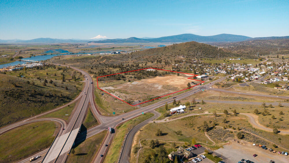 Major national truck plaza on the three busiest highways in Klamath County, Highways 97, 140 and 66. CROSSROADS is the largest regional transportation and shopping complex in Southern Oregon. Engineering complete, permits paid for and ready to build.  Owner will accept proposals for the entire 45 acre commercial site or partition only the 10 acre travel plaza.  This intersection will remain a destination hub for decades with commercial zoning, space for Costco and enough room for national franchises to serve the region. ''Owner will carry a contract''   OR Owner financing available
