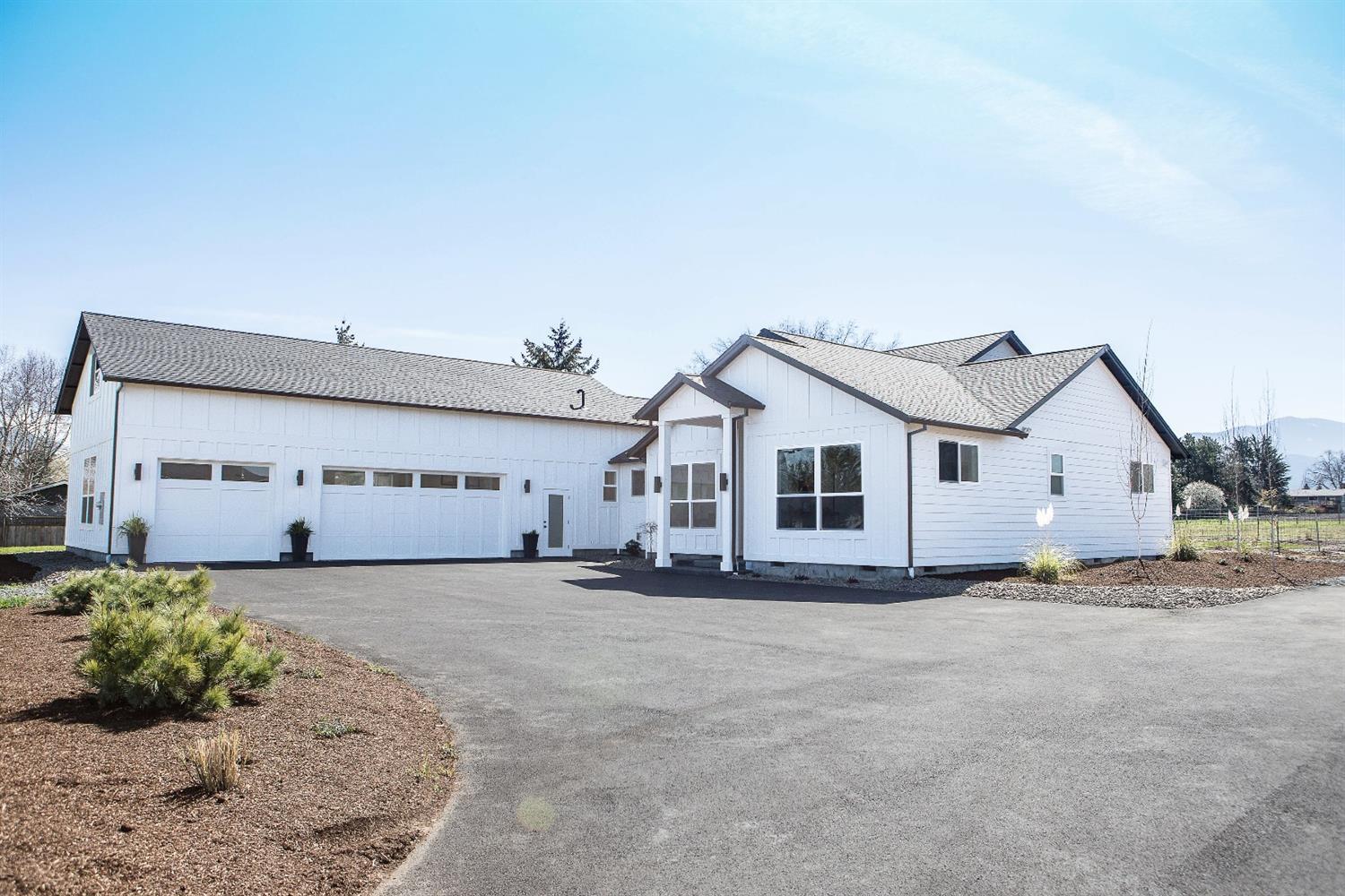 This beautiful new 2979 square foot home centrally located on 1.95 acres built by Cota Homes LLC and they thought of everything! This home has a very light and bright feel with an open floorplan that was designed for entertaining. The kitchen is spacious with a large concrete island, custom cabinets, bar seating, a gas range w/ double ovens, full separate refrigerator and freezer, a large butler pantry that has tons of storage, its own sink, and even more counter space! The great room has a beautiful modern fireplace with large windows that showcase the amazing view of the surrounding mountains. The master suite has a spa style walk-in shower with his and her sinks and walk-in closets! It features a split floor plan with 4 bedrooms, 2 and half baths, a large great room, and office space upstairs. It has an oversized 3 car garage and well house with extra storage for your toys or mower. Property features, EFU zoning, TID water, 38/gal/min artesian well, and a large paved driveway.