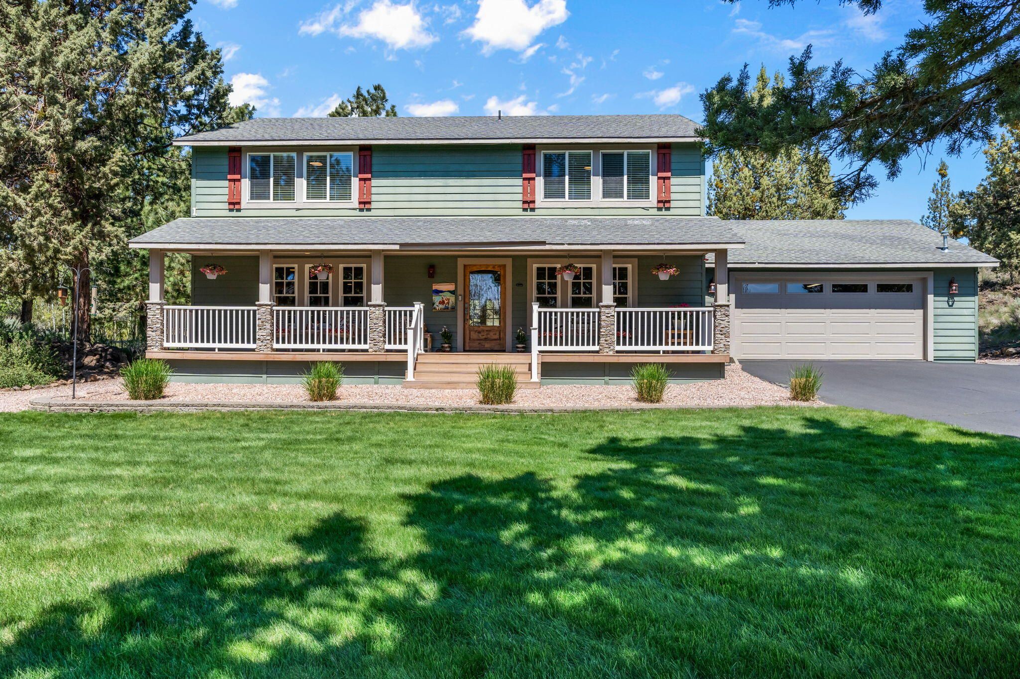 A rare offering for a beautiful and private small acreage property with too many features to list right in Bend! You'll want to call this home as you soon as you enter the property down the tree lined driveway. This partially irrigated 2.5 acre parcel comes with a clean and cozy 4 bedroom, 2.5 bath 2,518 sqft ranch style home with an additional living space that could be utilized as formal dining or home office. The property also features a fully insulated 1,080sqft state-of-the-art shop with a 10' garage door and 220v that is currently a woodworking shop. There is also a pond with an adjacent gazebo, small greenhouse, large enclosed garden area and a second gazebo looking out over the private and expansive park-like backyard. More great features include new appliances, smart lighting and thermostat, tons of storage, recirculating hot water and high-end air filtration system. Amazing to have this much space and privacy so close to town. This gem must be seen to be truly appreciated.