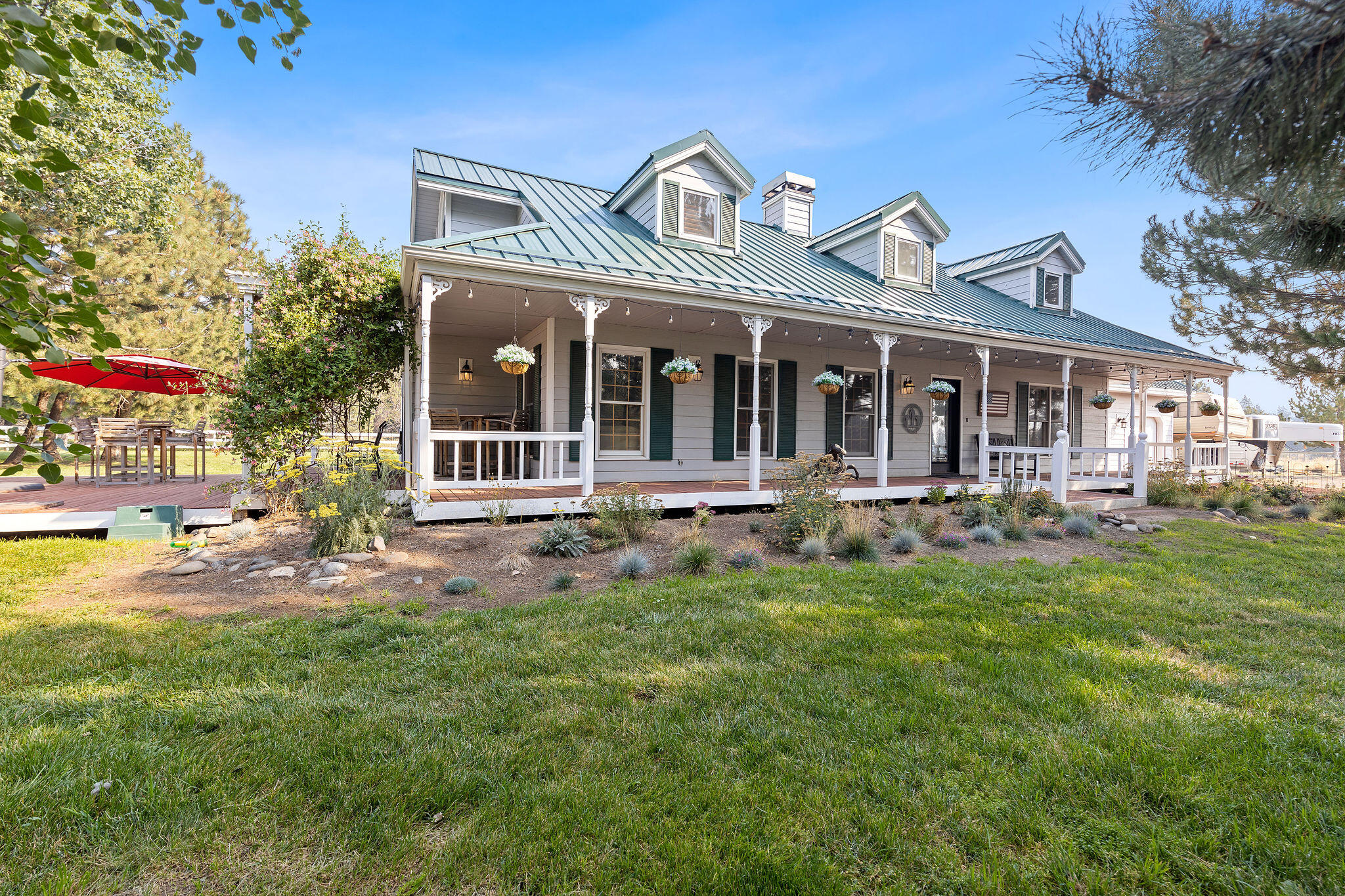 This property is a delightful 5± acre equestrian estate near Tumalo and just six miles from Bend. Known for breeding and training top horses in NRCHA, Team Penning, and Sorting competitions, it features a two-story home with three bedrooms and two bathrooms across 2,080± square feet. Highlights include wood-burning stone fireplaces, a wrap-around porch, a 20' x 24' deck, and a permit-ready plan for an expanded primary suite. The property also boasts a 24' x 36' barn, a 10' x 36' equipment shed, and a 12' x 24' run-in shed, all set in a mature landscape with stunning mountain views. Located on a cul-de-sac, Juliet Farm offers a peaceful retreat just 6± minutes from Bend, with easy access to shopping, dining, and skiing at Mount Bachelor. Experience a perfect blend of elegant living and equestrian excellence at this exceptional estate.