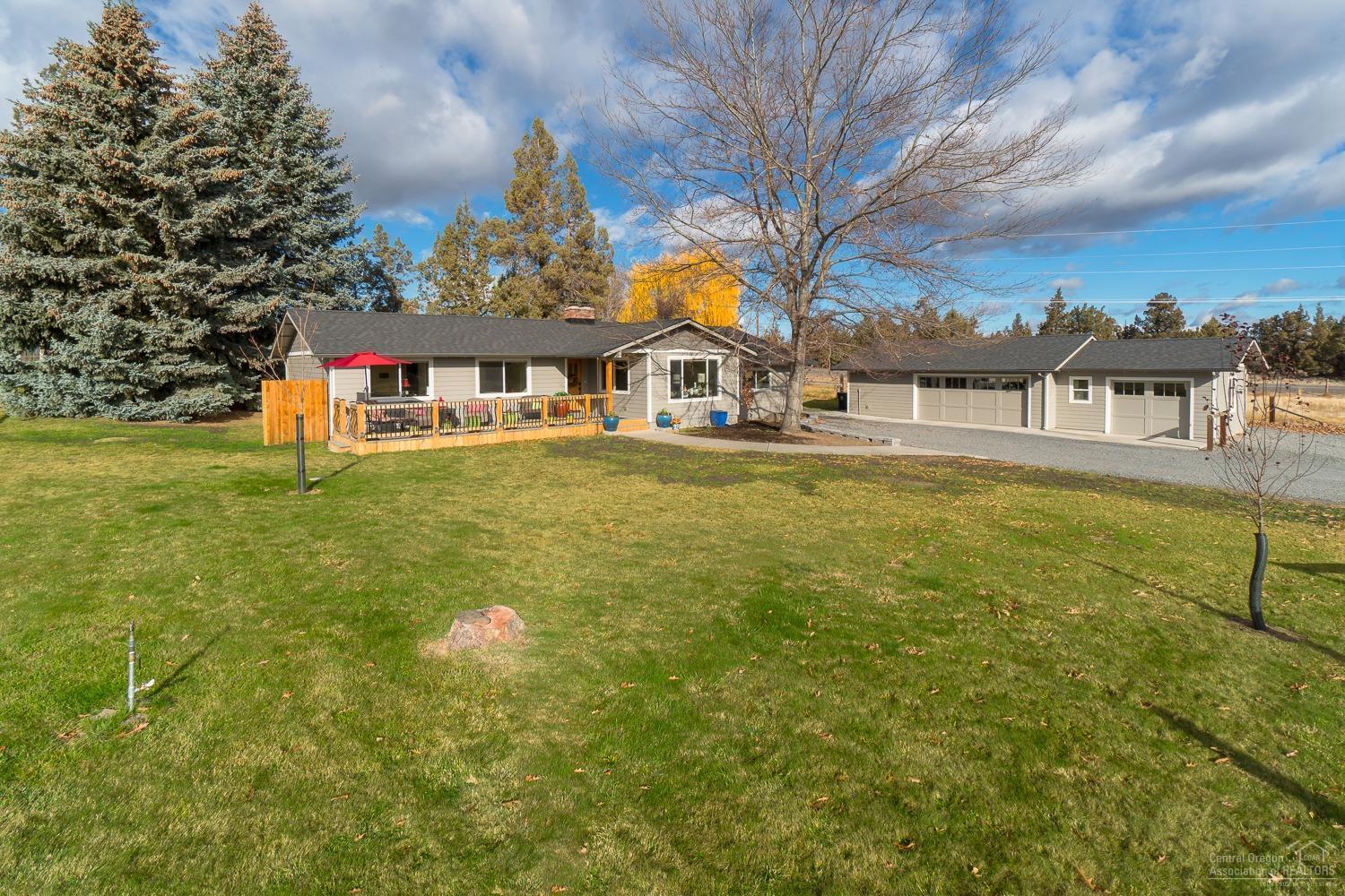 Perfect small acreage on the East edge of Bend! No detail overlooked on this home - 1874 sf of all brand new - siding, roof, systems, you name it, it's been replaced w/top of the line materials! Situated on 2.45 acres & across the road from BLM, complete w/ 2 pastures, underground irrigation, triple garage w/ home gym / ADU setup AND a new barn. Kitchen boasts Granite counters, full height Travertine back splash, tons of drawers & new SS appliances. New carpets, Oak hardwood floors, 2 stone fireplaces. Both baths offer Granite counters & tile floors & showers. Formal living room PLUS family/bonus room. Irrigated pastures are fenced w/water available 7 days a week!