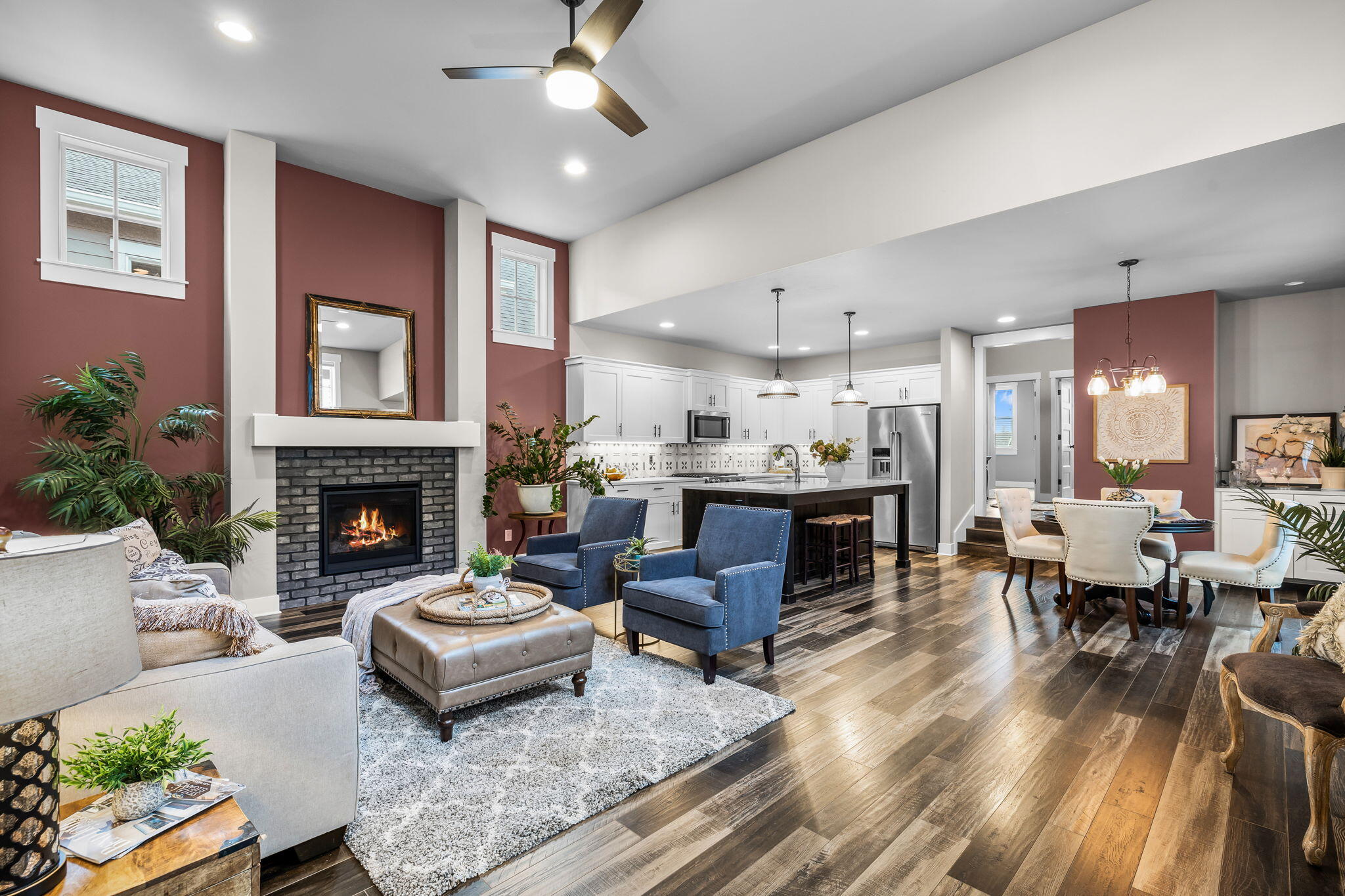 LIVE in the heart of popular Northwest Crossing in this beautiful 3 bedroom, 2 bath townhome, close to the Grove, shops, restaurants, parks, hiking & biking trails! Once you step inside you are welcomed by an open, airy floor plan, complete with soaring ceilings, walls of windows, gas fireplace & a kitchen with stainless-steel appliances, gorgeous quartz counters & a huge island.  The main level primary bedroom, w/dual vanities & a walk-in closet is nicely separated from the other bedrooms. Read a book and relax on the peaceful, side patio recently renovated with a charming paver walkway, landscaping & artificial grass. Engage with the community, neighbors and friends on the large front paver patio. Alley access to spacious 2 car garage.
 All this, your private sanctuary combined with the amenities of the vibrant neighborhood, makes this a wonderful place to live!