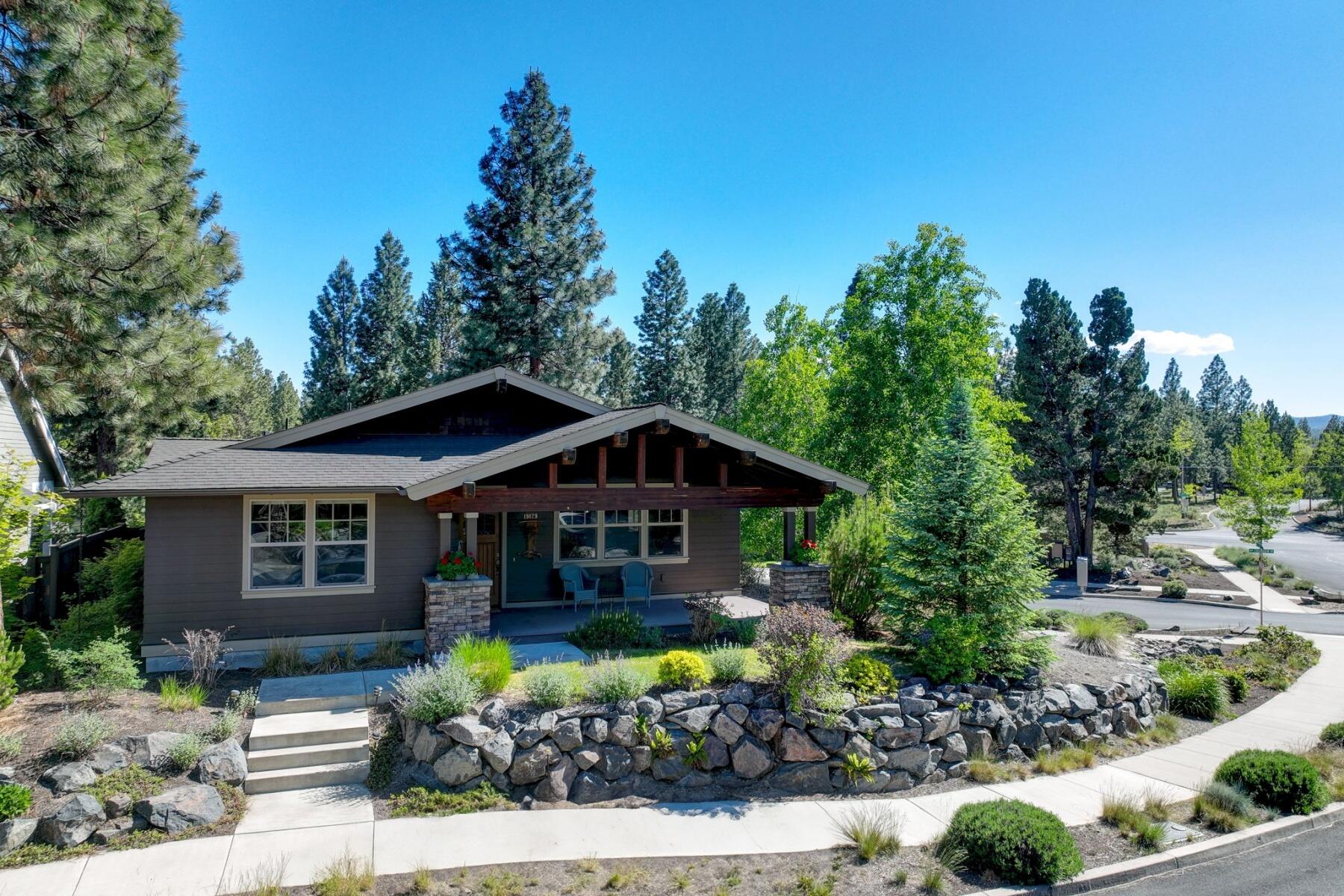 Welcome to this charming single-level home in Northwest Bend, situated on a desirable corner lot in Shevlin Pines. This classic craftsman-style residence features an inviting front porch and an open great room, perfect for entertaining & family gatherings. The kitchen boasts tiled countertops, beautiful wood cabinetry with metal pulls, and ample built-ins for all your storage needs. Enjoy the warmth of the gas fireplace in the living area, complemented by a mix of hardwood, tile, and carpet flooring, with tasteful lighting throughout. Step outside to your fenced backyard, an ideal space for outdoor activities or relaxing on the deck. The property also includes a convenient two-car garage. Located just minutes from the renowned Shevlin Park, with easy access to Tumalo Creek, majestic old-growth Ponderosa Pines, and an expansive trail system for all your outdoor adventures. Seller is providing a $5K carpet credit.