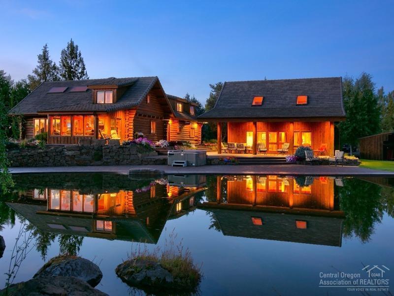 Serenity awaits you at this stunning log home retreat nestled on 8.64 private acres just minutes from Bend. Granite countertops throughout, slate flooring, dramatic vaulted ceilings w/light & bright feeling. Guest house features an additional 1,210 sf with a full bedroom & bathroom plus a loft with built in bunks beds. Adjacent 10 acre parcel is also available for purchase. Enjoy this park like setting with views of the cascades from your hot tub and peaceful swimming pond with stunning waterfall!