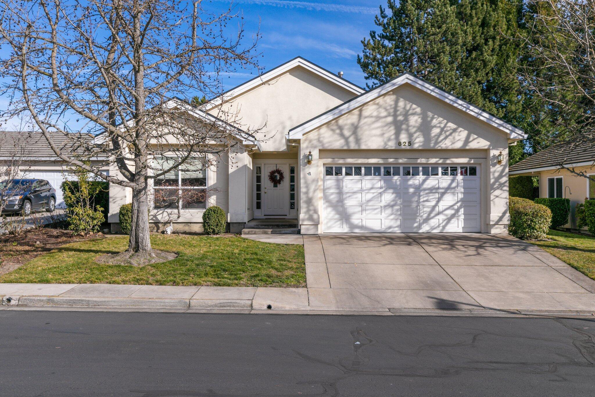 Homes rarely come up for sale in this exclusive neighborhood in East Medford. 
Welcome home to this light and bright 2 bedroom/2 full bath house nestled on a peaceful cul de sac in an east medford gated community. This home boasts an open split floor plan with vaulted ceilings, gas fireplace in the living room, Electric glass top stainless range, soft bright colors, covered patio area, and an attached 2 car garage. Close distance to medical facilites, and shopping. Mahar built with stucco exterior and tile roofing, all you need to do is sit back and relax. Neighborhood HOA takes care of all landscaping maintenance, front and back.