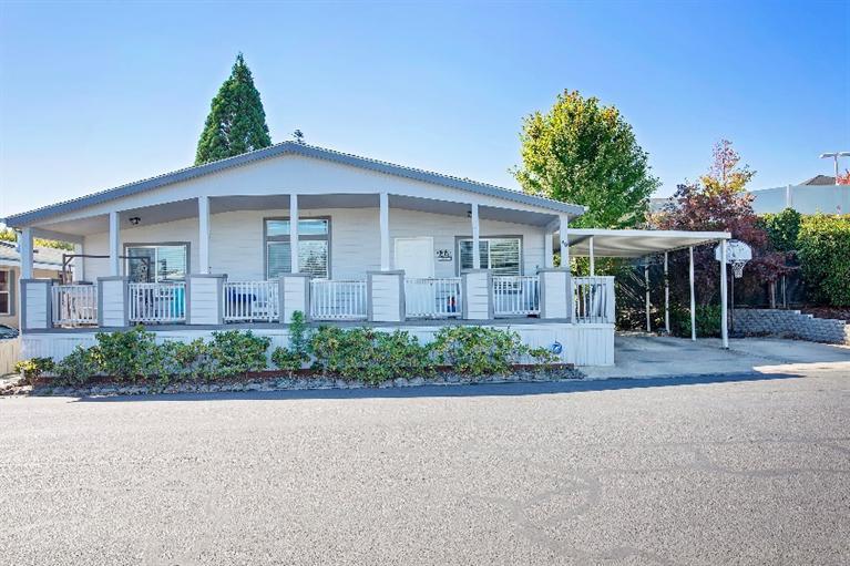 Immaculate triple wide! This oversized manufactured home offers 1600 sf of open floor concept with lots of natural light a gorgeous kitchen with island perfect for entertaining, This home offers charming foliage that is a breeze to maintain. You will find this home located in Medford Estates Mobile home park that offers so many conveniences and is perfect for someone on the go or stay! The park has a club house and swimming pool just a short walk from this unit.