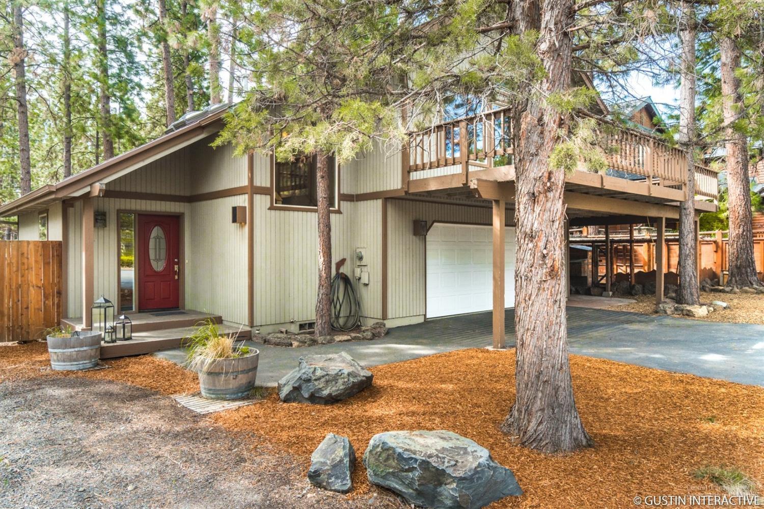 Extraordinary on 1st On The Hill cottage! High amongst the pines this retreat rests on a large tranquil lot & features a vaulted great room full of natural light, wrap around decks, updated kitchen w/custom cabinets, concrete and butcher block counters & JennAir appliances. Amazing landscaping complete w/fruit orchard, vegetable garden, yurt, & more. XL 2 car garage w/plenty of gear storage for toys. Sale includes plans for a 2 bed 1/2 bath addition. Yurt and hot tub negotiable. An authentic Bend gem!