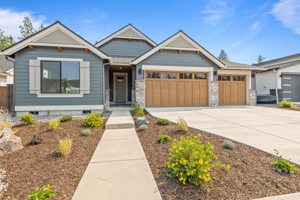 MOVE-IN READY! Home site 25, set strategically amongst a beautiful stand of Ponderosa Pines is Collier the newest Pahlisch Homes Signature community in northwest Bend. With nearly all home sites backing green space the feeling here is incredibly peaceful. Situated less than a mile from the shops and restaurants at Northwest Crossing and nearby parks and schools you are close to all the happenings in northwest Bend. Enjoy having all the trails right outside your backyard and easy access to Mt. Bachelor and the Cascade lakes. The Carrington floor plan is amongst our favorites with its ideal size and open space. Natural light from the abundance of windows make this home light and bright. With the two guest rooms and a spacious primary suite this home is perfect for those looking to down size. High-end finishes like JennAir appliances, tile walk-in shower and engineered hardwood floors complete this stunning home.