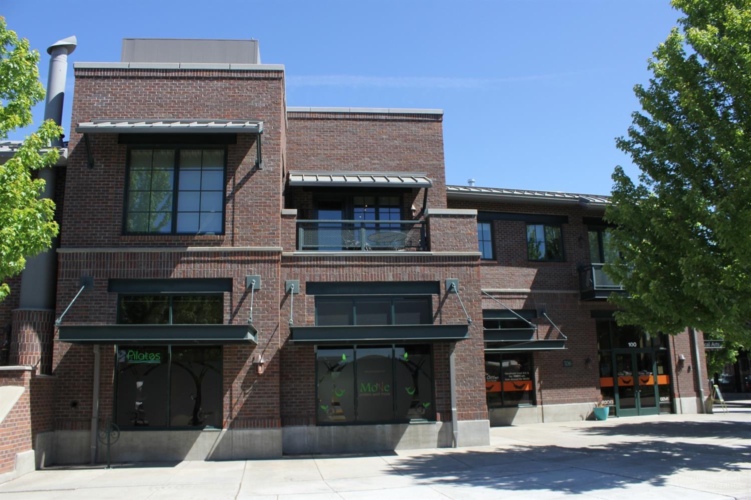 Mixed use opportunity in Mill Quarter. 2 ground level retail spaces and one beautiful 1bd 1.5 bath loft apartment above with two balconies. Built completely out of brick,mortar and ICF construction. Zoned mixed riverfront. Many options with this rare high quality property in the middle of the Mill District.