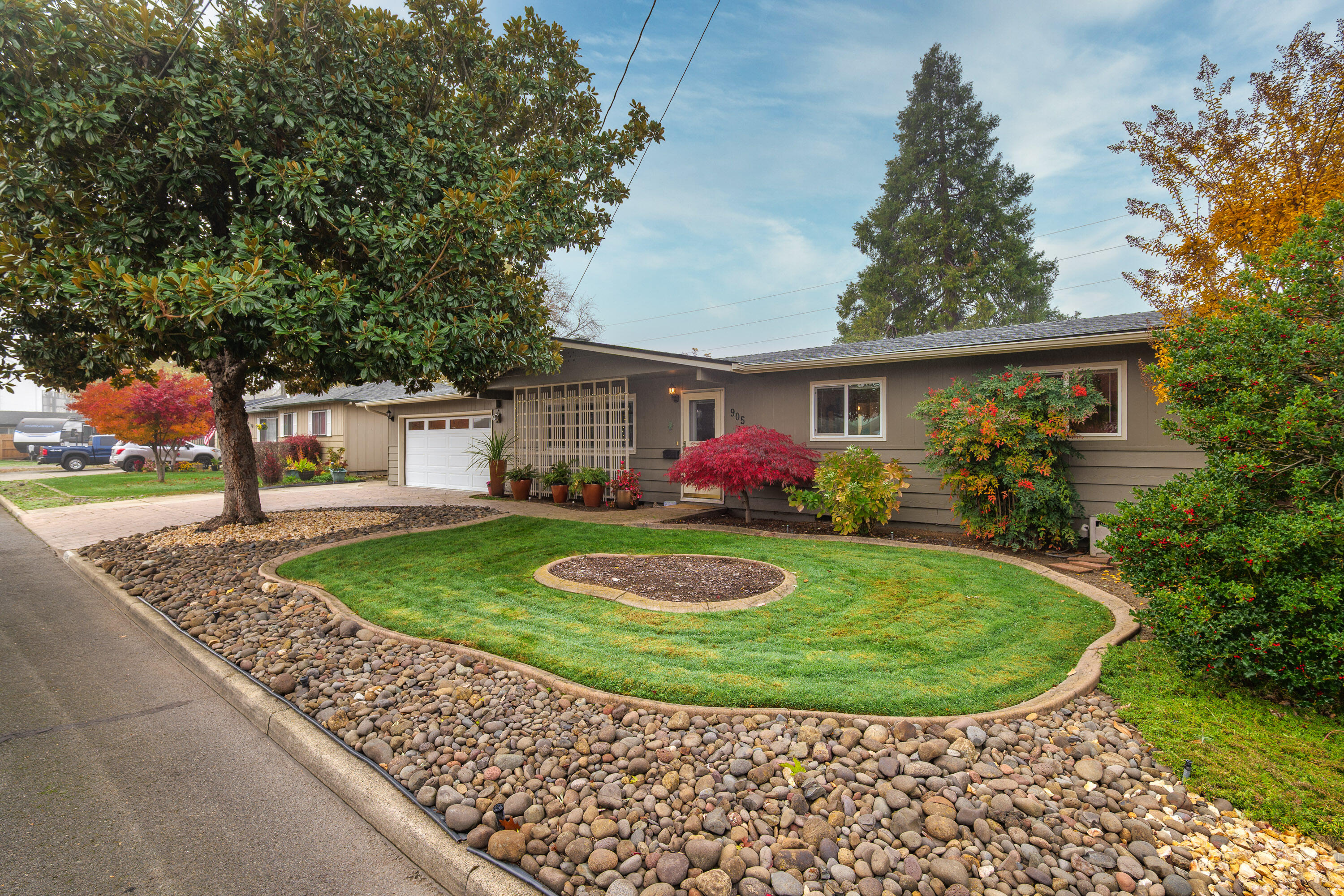 Completely move-in ready, this charming 1,170 SF Central Point home combines modern upgrades with a private, park-like setting. Built in 1963 and extensively remodeled, the 3-bedroom, 1.5-bath residence sits on a beautifully landscaped 0.23-acre lot backing up to Griffin Creek. The home features a stylish kitchen with granite countertops, updated finishes throughout, and an inviting open layout ideal for everyday living. Enjoy outdoor relaxation on the covered deck overlooking the large, fully fenced backyard—perfect for entertaining or pets. Additional highlights include a fully insulated attached two-car garage, mature trees, and well-maintained grounds. This property offers a rare blend of convenience, comfort, and outdoor appeal—completely turnkey and ready for its next owner.