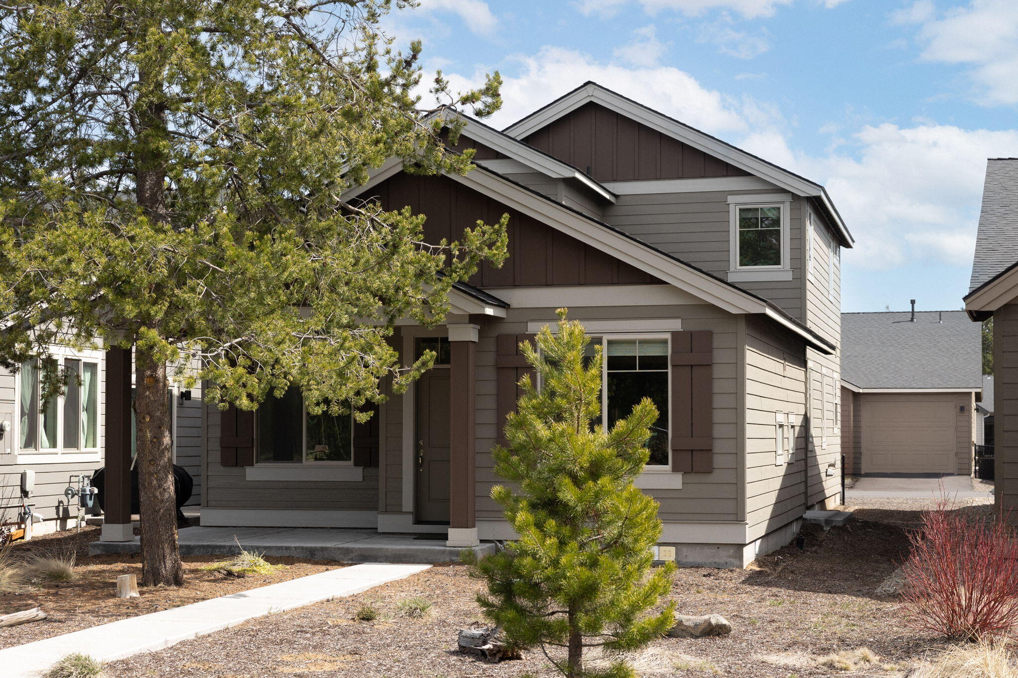 Owners offering direct financing at only 5% interest! This stylish 3-bed, 2.5-bath home in La Pine's Crescent Creek neighborhood offers 2,010 sqft of light, bright, and comfortable living space. Along with the primary bedroom and full bath, the downstairs features an open floor plan with a gas fireplace, high ceilings, custom window treatments, and a beautiful kitchen with quartz countertops, stainless steel appliances, a large island, and plenty of cabinet space. Upstairs features 2 spacious bedrooms and a full bath, as well as an additional open area that would be great to use as media room or additional living space. Outside the house is a nice covered patio, an in-ground irrigation system, and unobstructed views and access to an adjacent park that will make it easy to enjoy any time of year. Crescent Creek offers amenities such as a clubhouse, walking paths, an open park, and access to a trail system that connects to downtown La Pine. Call your broker to schedule a time to tour!