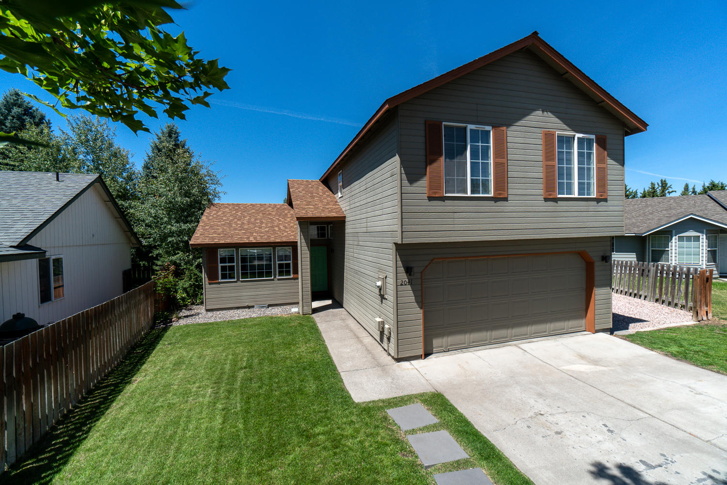 Newly refinished & ready for you to move in! Conveniently located in SW Redmond w/easy access to Bend, this home is turn key for the new owner or investor. Entry way opens to a vaulted living area w/barnwood accents & wood look Laminate flooring. Galley style kitchen w/plenty of counter space & storage w/new SS refrigerator, dishwasher & glass top range/oven. Adjacent formal dining area opens to the deck & back yard for easy indoor/outdoor entertaining. Powder bath/laundry room off of the garage hall was just redone too! Upstairs you'll find an ample sized Master Suite & 3 additional bedrooms along w/a full bath. New fixtures & paint, freshly cleaned carpet & anything but plain white colors throughout. Window A/C unit included for warm summer nights! Double car garage w/built in shelving is great for storage & organization. RV parking on the north side of the home is lg enough for a camp trailer/RV AND your boat too. Fenced yard w/landscaping & auto sprinkler system. Don't miss!