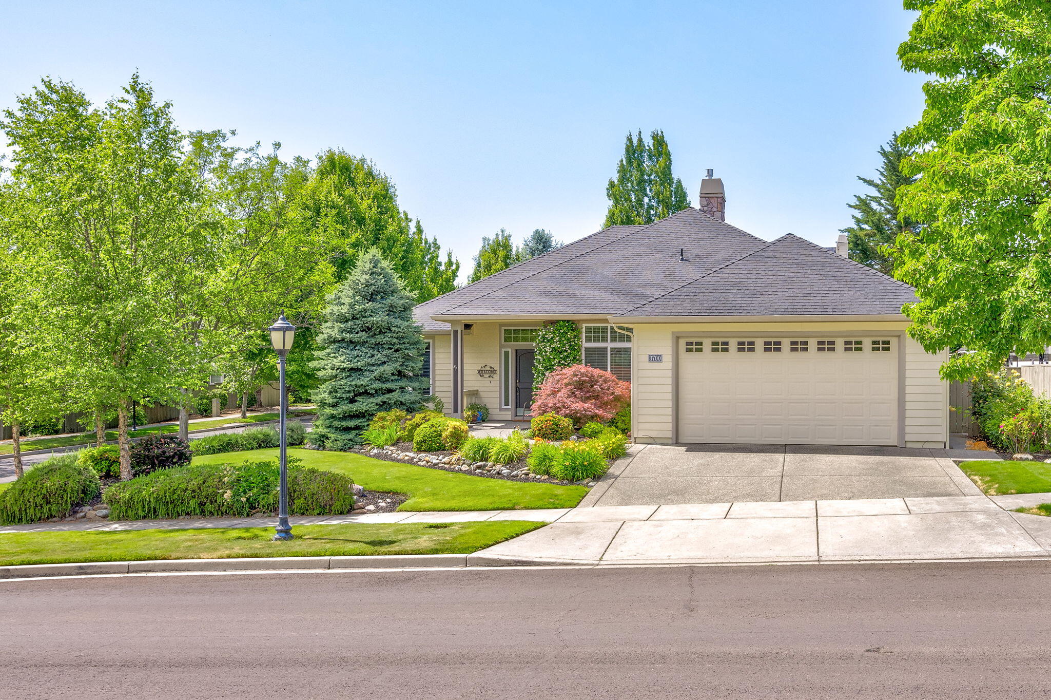 Welcome to your dream retreat! Nestled in a sought-after community, this stunning 4-bed, 2-bath home, built in 2004, sits on a .21-acre corner lot with 2,449 sq ft of luxurious living. Flooded with natural light, it boasts vaulted ceilings and a cozy brick stone gas fireplace. The remodeled kitchen shines with granite countertops, a motion-sensor faucet, gas stovetop, walk-in pantry, and ample storage. The primary suite, featuring a lighted coffered ceiling, walk-in closet, spa-like bath with a walk-in shower, tiled walls, soaking tub, block glass window, and skylight. The second bath offers a walk-in shower, tiled walls, and skylight. Fresh paint, new wooden blinds, updated flooring, a new roof. Relax on the serene patio with a water feature, ideal for entertaining. With ample storage and a prime location near restaurants, medical facilities, and schools, this move-in-ready is your sanctuary. Home includes a 1 year Home Warranty.