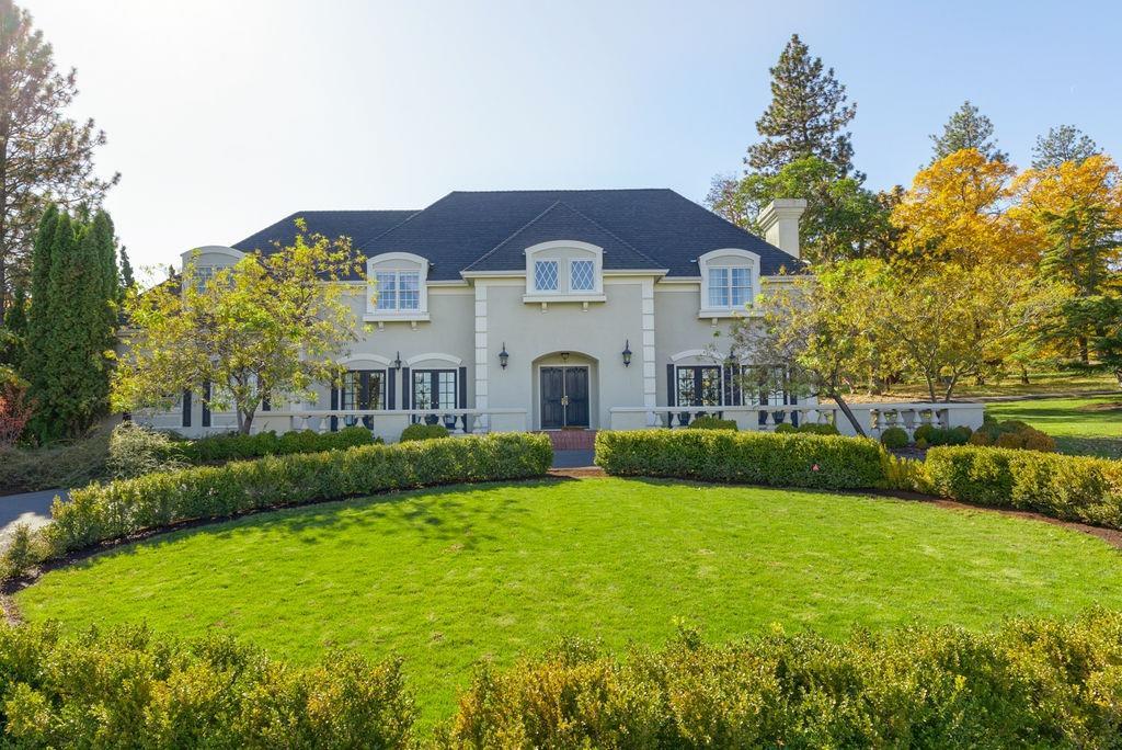 Custom-built French Chateau on 15 ACRES! Located minutes from Jacksonville. Sweeping country views. This one owner estate, features over 4,200 sq ft. with 5 bedrooms, and 4.5 baths. The elegance and style of this home are unmatched. The marble floored entry way leads to a carved oak spiral staircase. The living room is designed for entertaining with three sets of French doors leading to the patio. The library, designed to fit oak paneling from an 1830's English town home, includes a wet bar and custom stained-glass windows. German tile floors in the kitchen, eating area, and laundry room. Large media room off the rear entry foyer. Second floor boasts 3 full baths and a large master. If the impeccable attention to detail in the home wasn't enough; the property includes a five car garage, rose garden, and swimming pool. The property has two gated entry points, a circular driveway, plus additional parking.