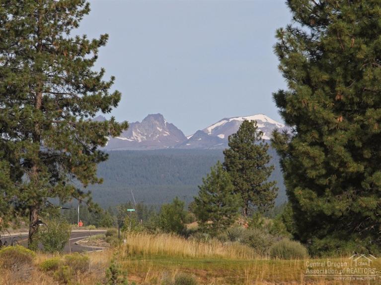 Prominent, well positioned lot providing a blend of features people seek in a custom home site. Mtn views protected by nearby Ponderosa's. Next to 12th green yet insulated from golf course traffic. Private end of cul-de-sac privacy yet direct access to public Metolious Dr. Openness to neighboring home sites yet sense of community. Orientation for south light yet ability to capture sunrise and sunset views. Flat lot allowing for easy build and max utilization of .52 acre home site.