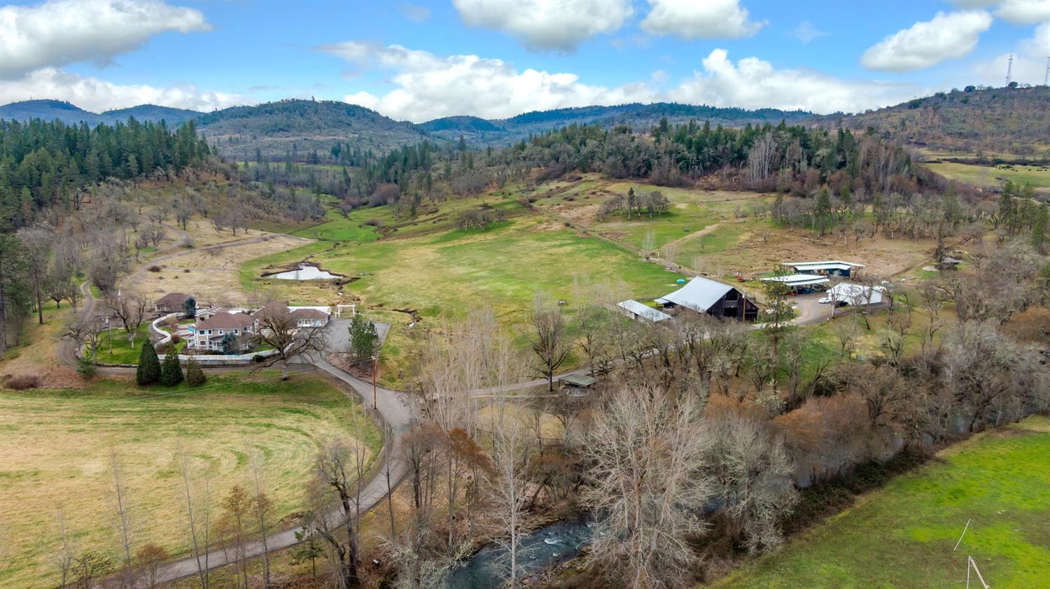 Welcome to a ranch that is not only beautiful but designed to accommodate so many avenues of ranching or farming. 326+ acres with 116 under irrigation offering a combination of pastures, rolling hills, park-like forest, and hilltops. Main home has spacious bedrooms, in-ground pool with an outdoor kitchen and a wonderful guest home. In addition, a three car garage and a small shop. Just up the path is a cottage that would make a great hobby room, office, or studio. The working facilities have plenty of shop space, hay barns, corrals and horse stalls. Top it off with a second home - great for a ranch manager! The land is full of beauty that truly captures the heart of Southern Oregon! The Pitchfork ranch has been in their family for a very long time and now is your opportunity to make it your own. You could not ask for a better location, just outside of town in Eagle Point!