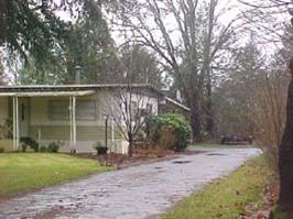 BEAUTIFUL LAWN, NICE SHADE TREES, ALL SERVICES ARE IN - READY FOR YOUR HOME OR MANUFACTURED HOME. HAVE A SPRINKLER SYSTEM IN FOR FRONT ONLY. THIS HAS AN OLDER MOBILE - VALUE IN IN THE LAND. SELLING AS A BUILDABLE LOT ONLY. 2 STORAGE BLDGS. WITHIN 3 BLOCK RADIUS OF STORES, PARK & SCHOOLS.